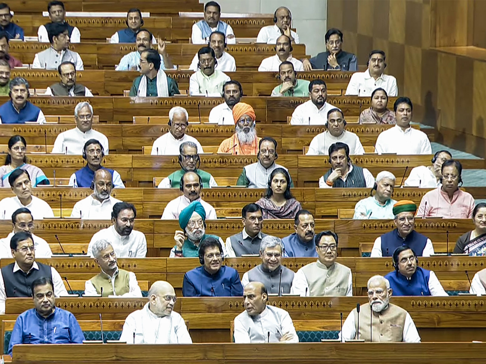 Prime Minister Narendra Modi, Union Ministers Amit Shah, Rajnath Singh, Nitin Gadkari, S Jaishankar, Piyush Goyal, Ashwini Vaishnaw, Kiren Rijiju, and others in Lok Sabha  (Photo/Sansad TV)