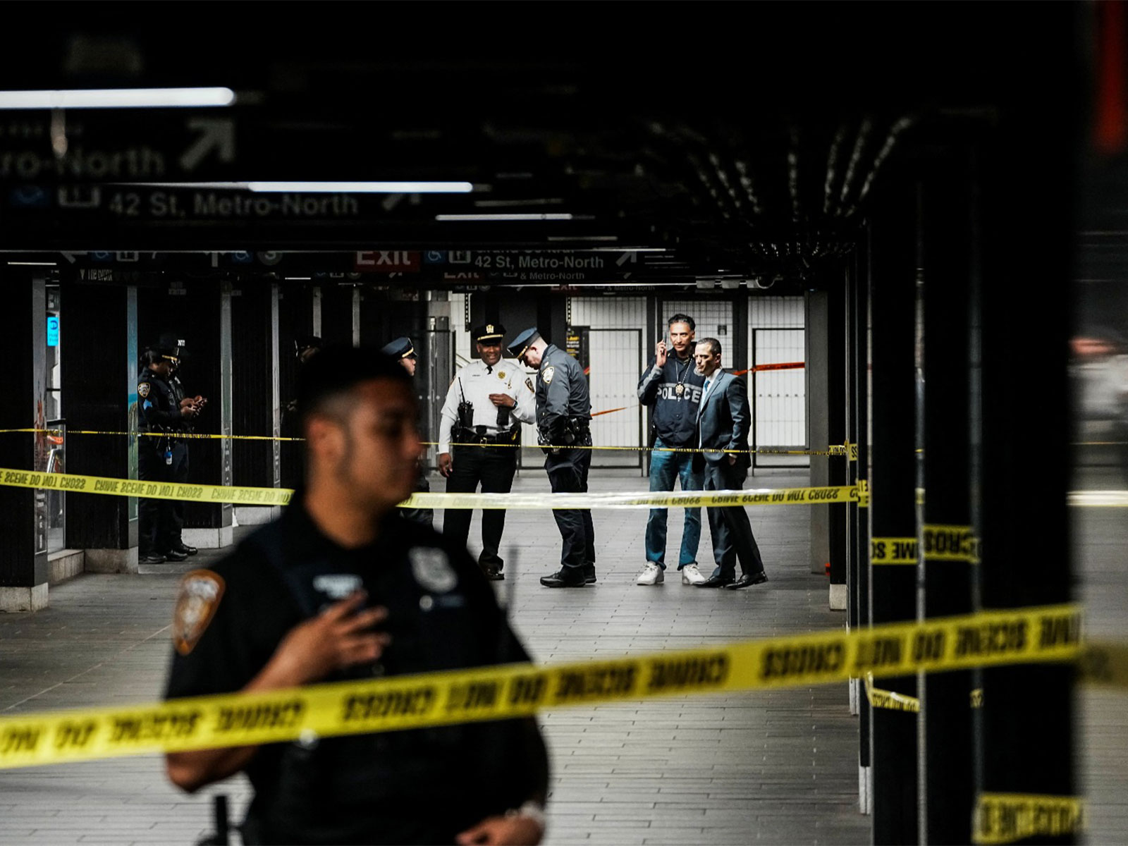 New York City Police Department (NYPD) officers stand guard near the crime scene where three people were attacked inside the subway system at Grand Central Station in New York (Photo/Reuters)
