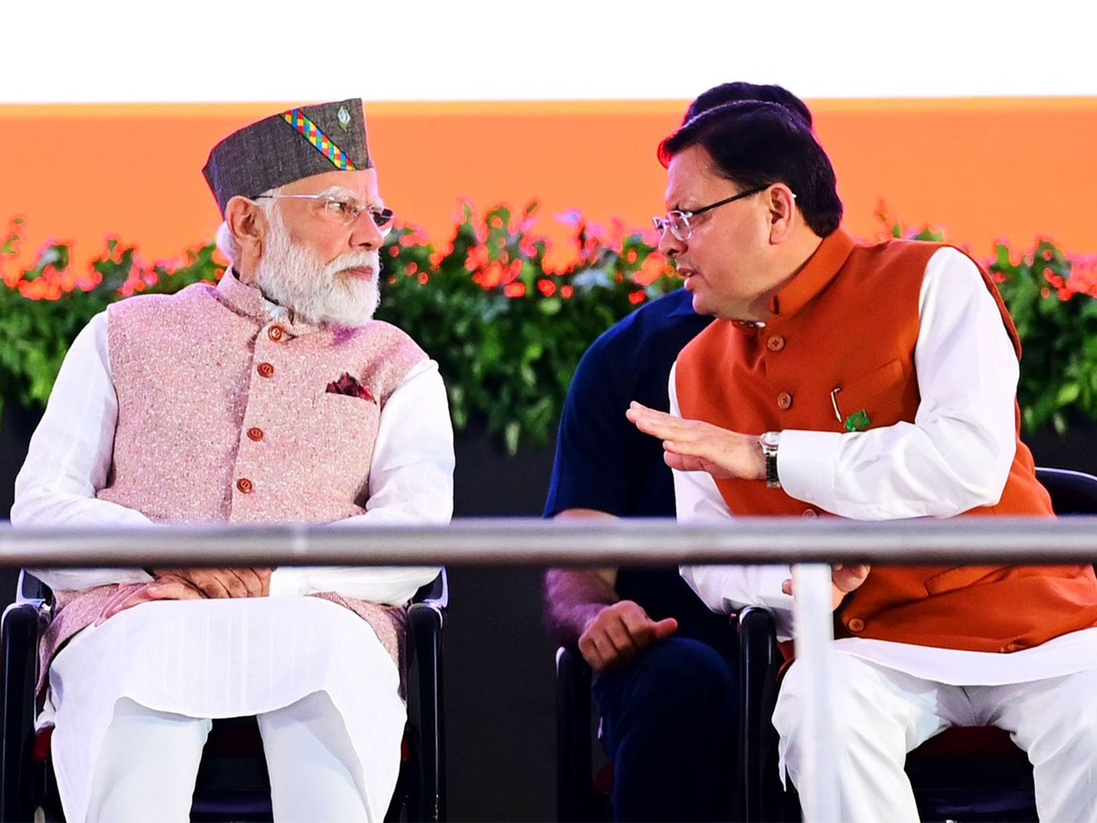 Prime Minister Narendra Modi (L) and Chief Minister Pushkar Singh Dhami (R)(File Photo/ANI)