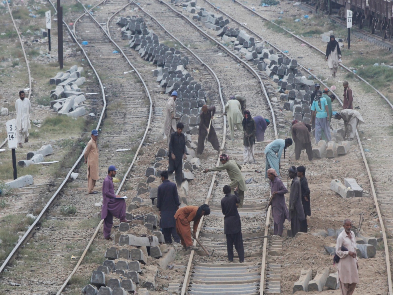 Labourers working along railway tracks in Pakistan (File Photo/Reuters)