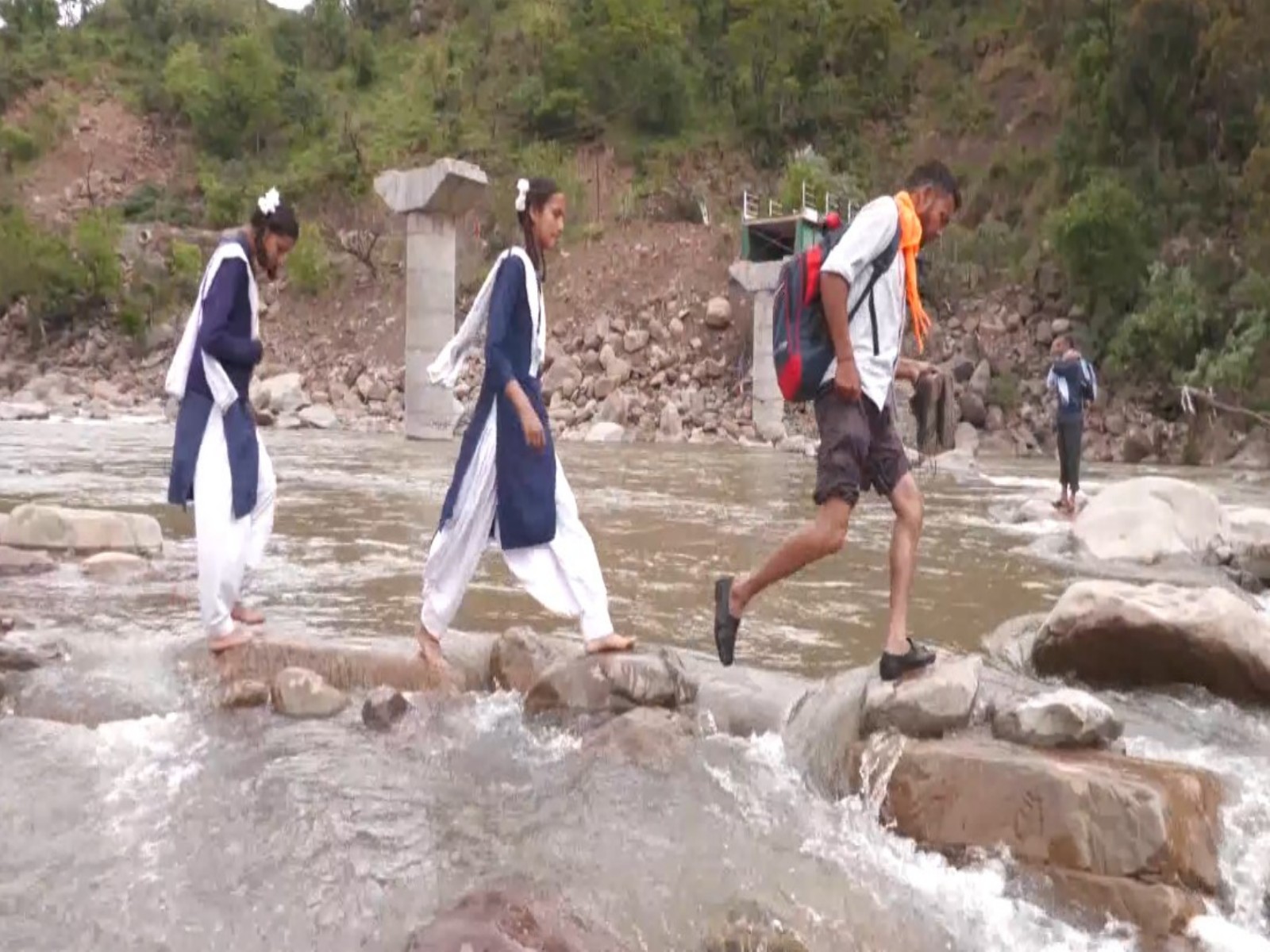 Students crossing Tawi River after bridge collapse (Photo/ANI)