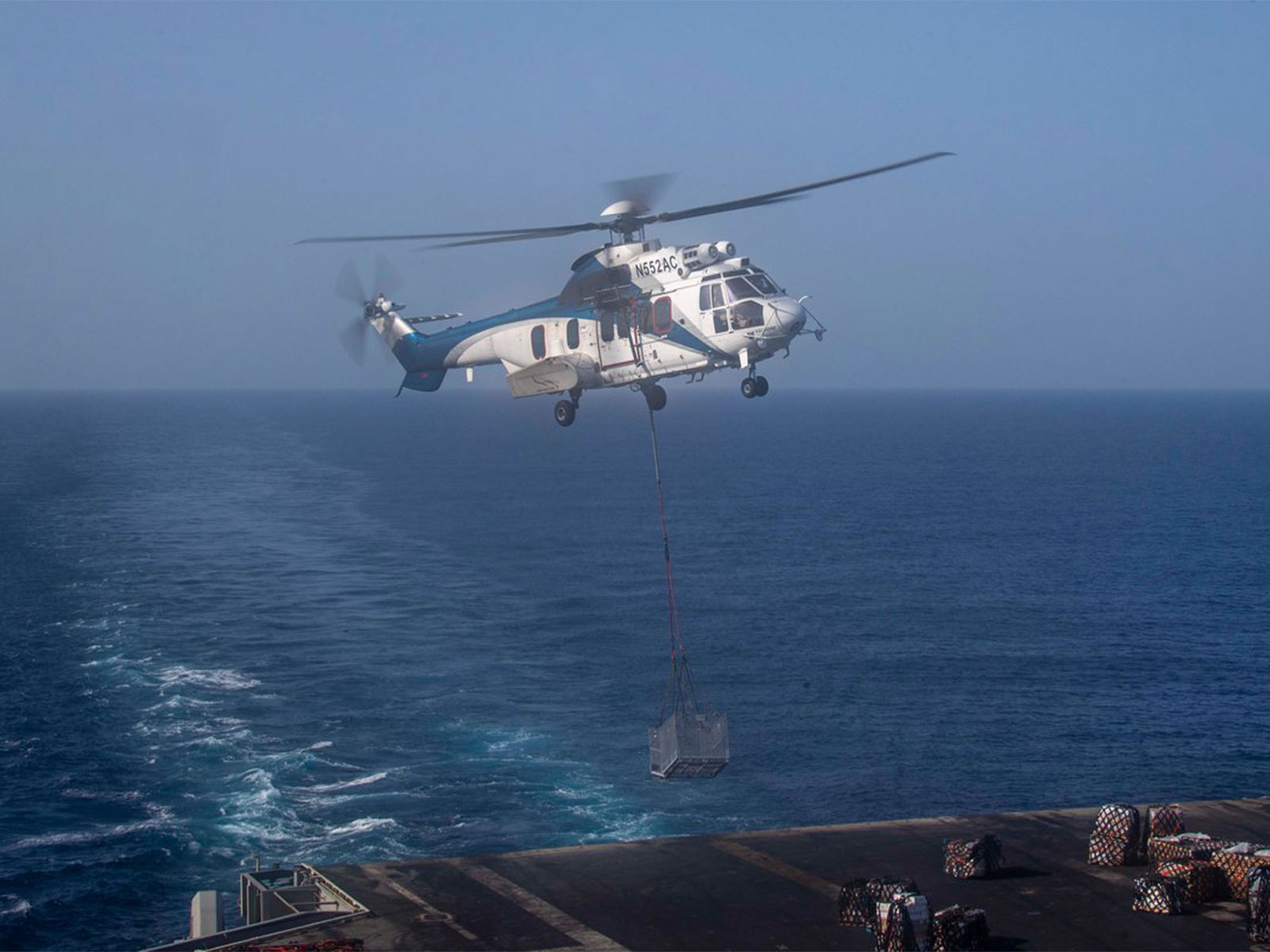 USS Abraham Lincoln (CVN 72) receives supplies during a "vertical replenishment" in the Arabia Sea (Photo/X/@CENTCOM)