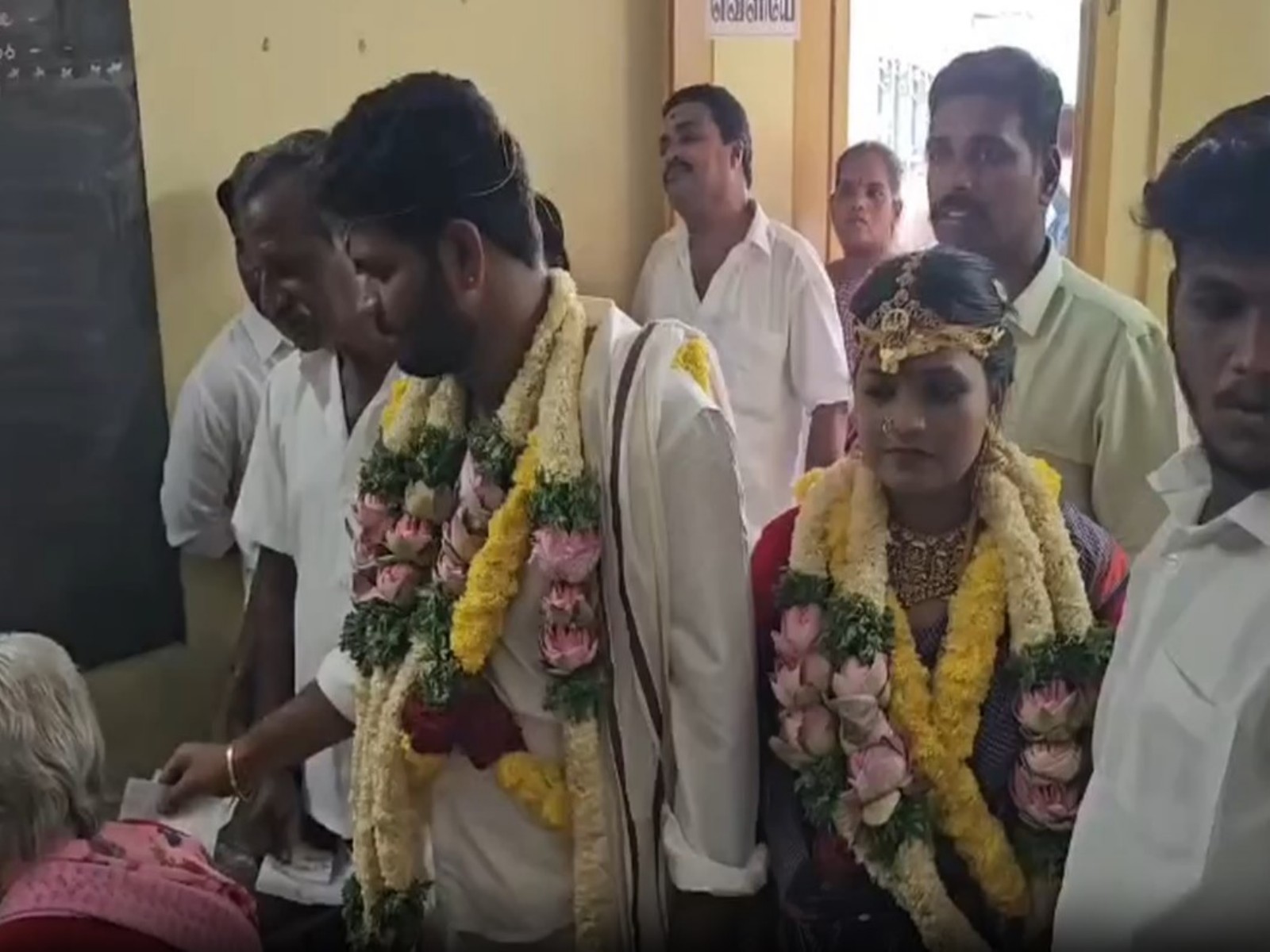 Groom and bride casts vote after wedding in Kanchipuram (Photo/ANI)