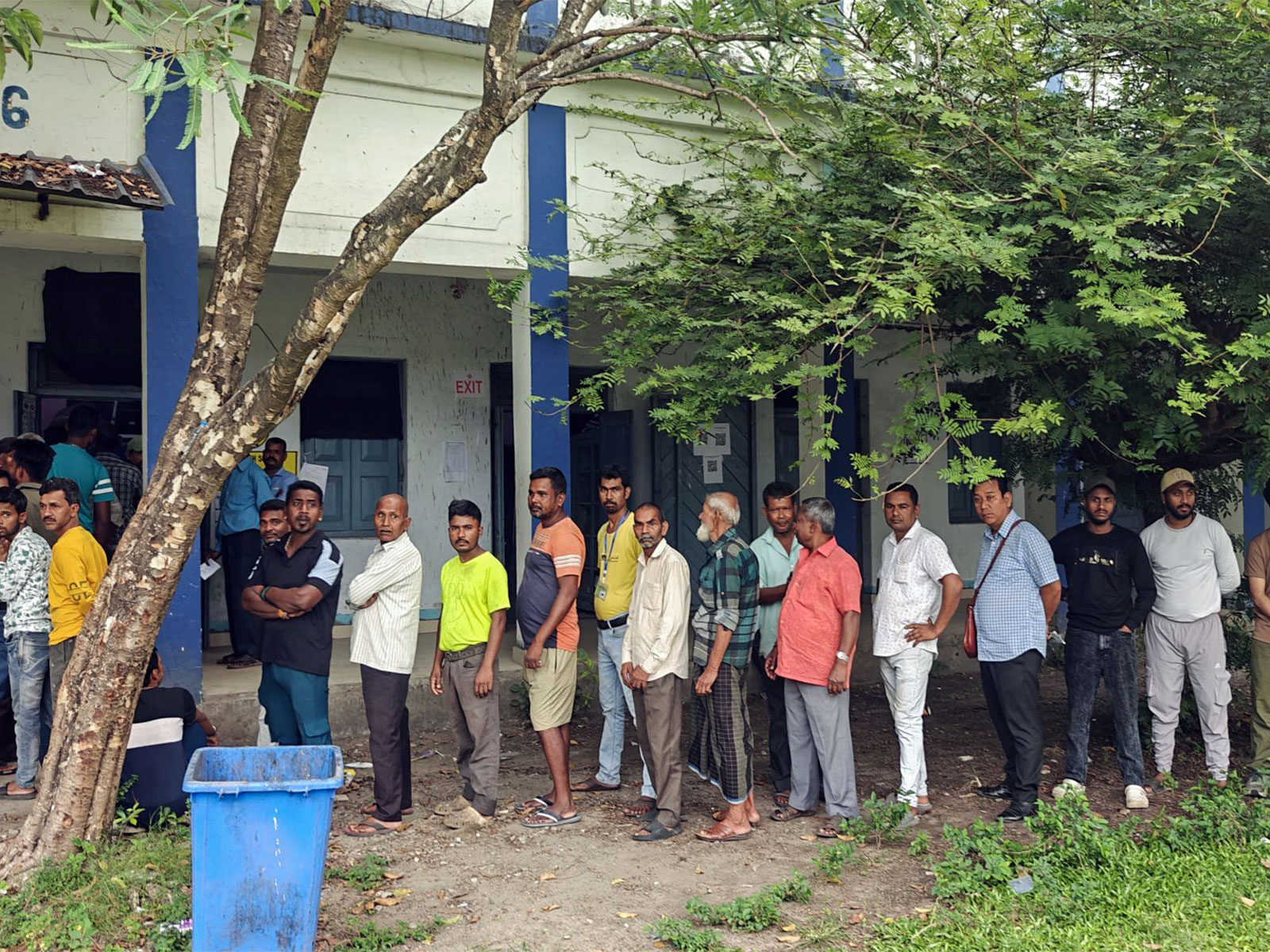 Voters standing in a queue in front of polling station to cast a vote during the first phase of the West Bengal Assembly Elections in Malda (Photo/ANI)
