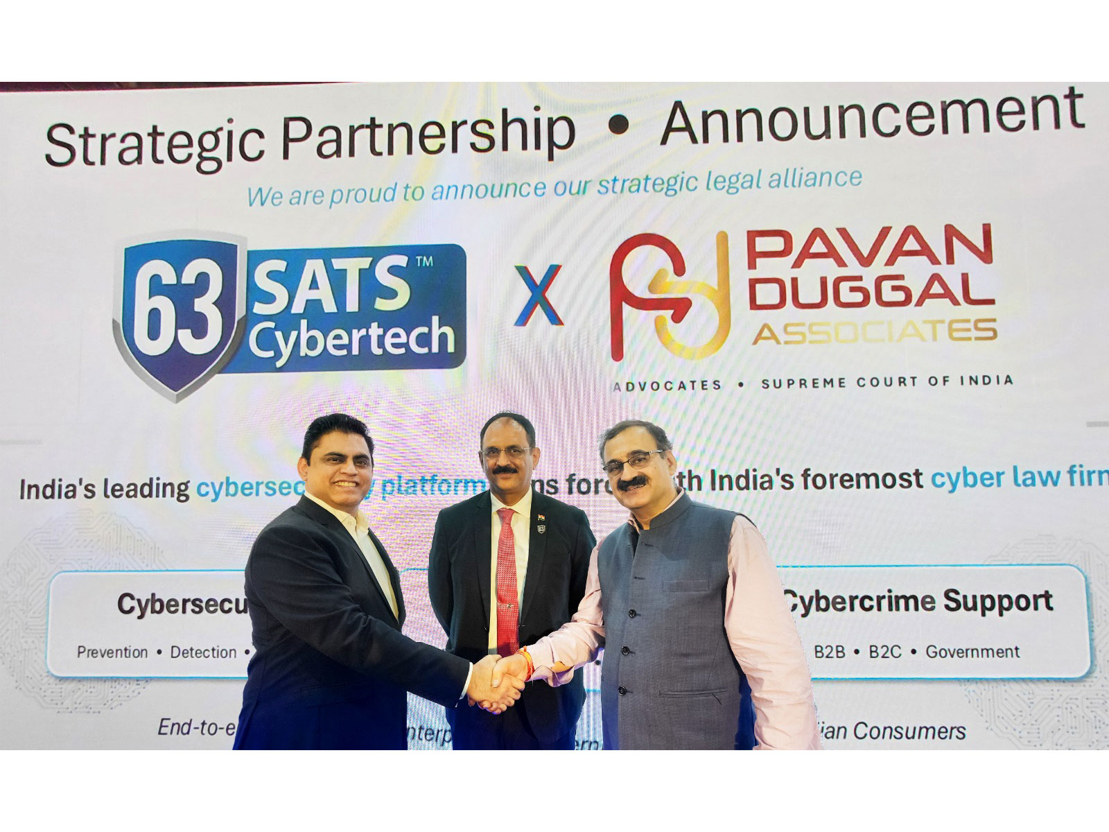 63SATS Cybertech MD & CEO Neehar Pathare joins hands with Dr. Pawan Duggal for a strategic alliance in front of 63SATS Chairman Lt. Gen M U Nair during CyberSec Expo in Mumbai