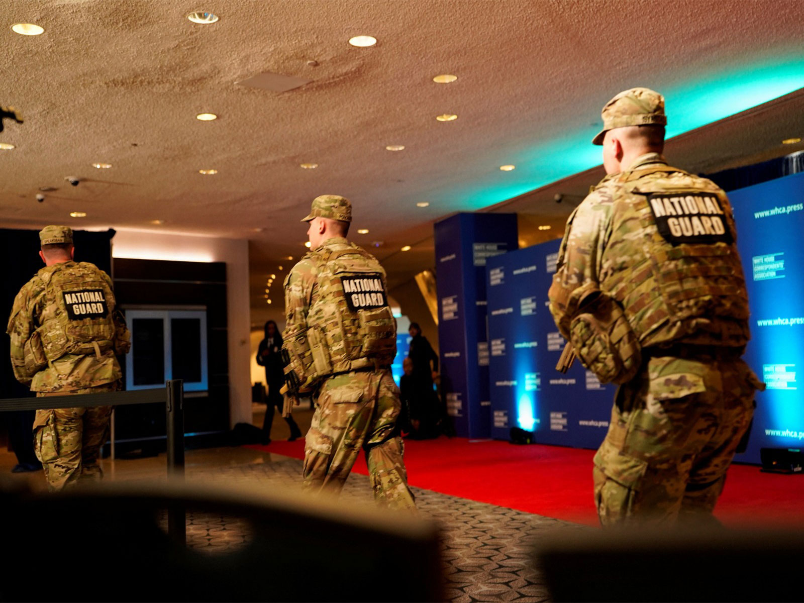 Members of the National Guard rush next to the red carpet of the annual White House Correspondents' Association dinner after a reported shooting incident in Washington DC (Photo/ Reuters)