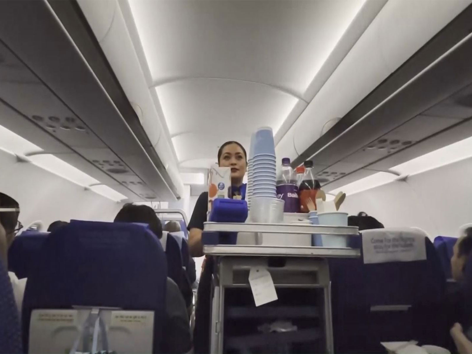 Cabin crew serves refreshments onboard an IndiGo flight on the Delhi-Guangzhou route, marking the resumption of direct air services between India and China. (Photo/ANI)