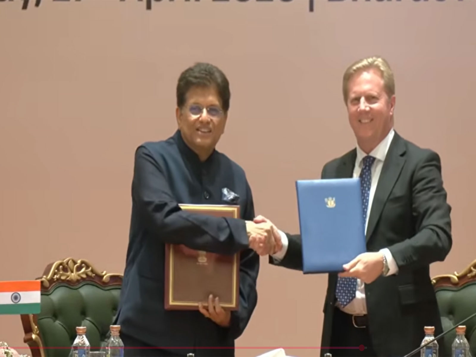 Piyush Goyal and Todd McKlay shake hands post signing the FTA (Photo/ANI)