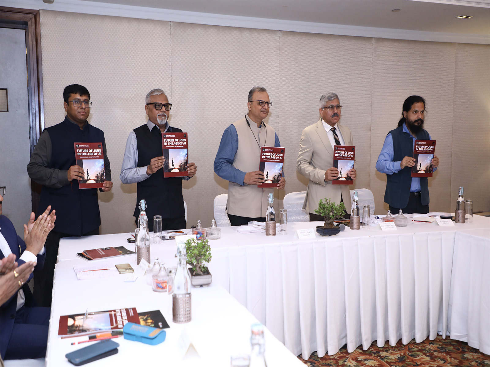 Panel members display the report "Future of Jobs in the Age of AI: Emerging Roles, New Opportunities" at its launch. (Photo/ANI)