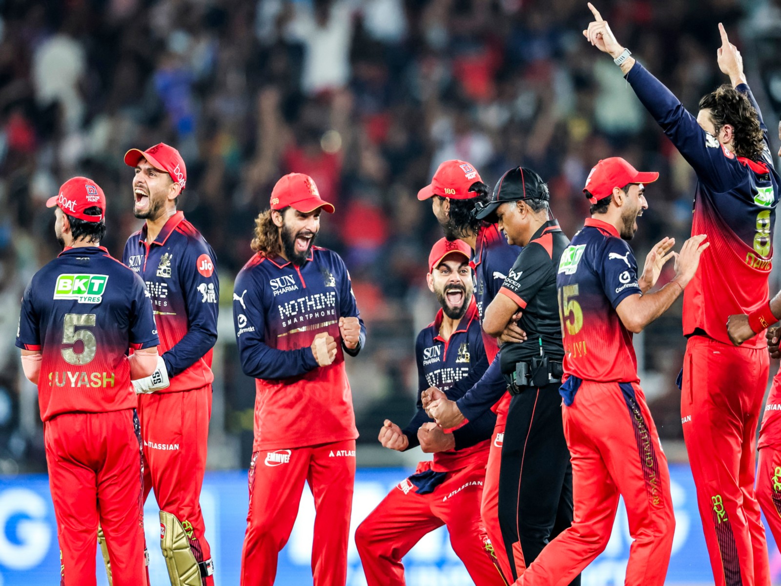 RCB team celebrating a wicket. (Photo: ANI)