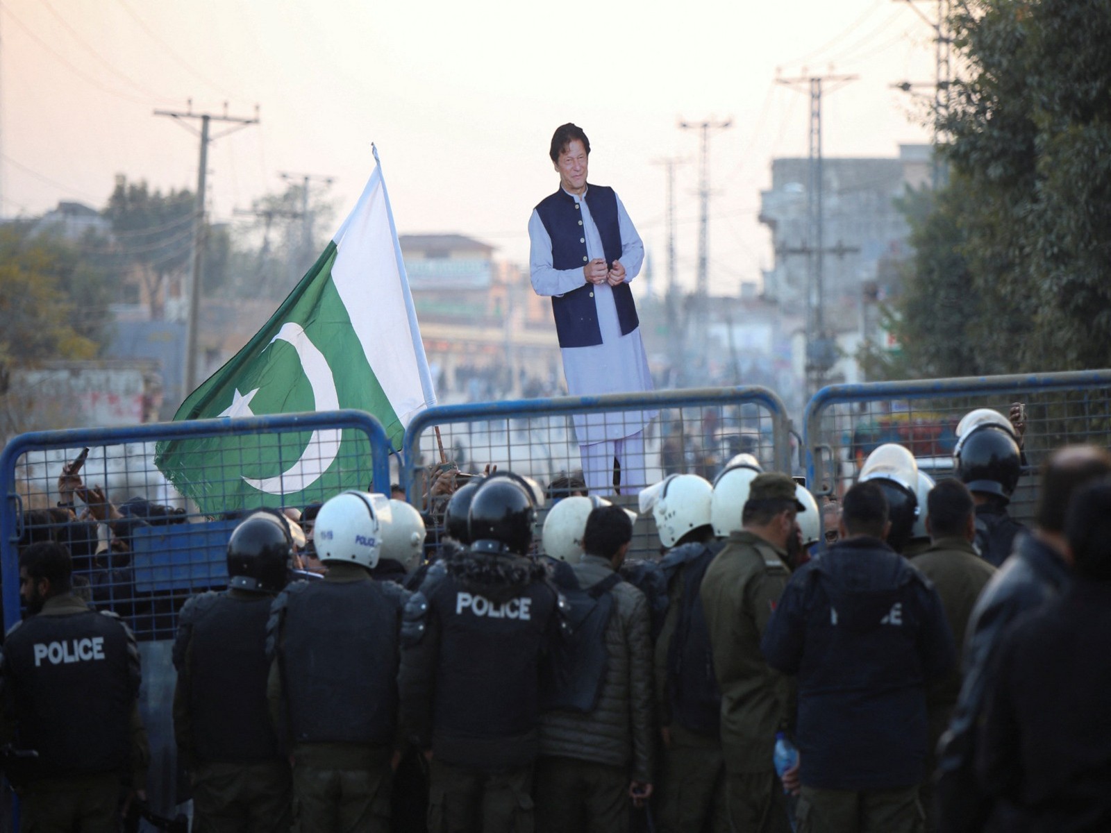 A supporter holds a cutout of former Prime Minister of Pakistan and Leader of Pakistan Tehreek-e-Insaf (PTI) party Imran Khan, in Rawalpindi (File Photo/ Reuters)