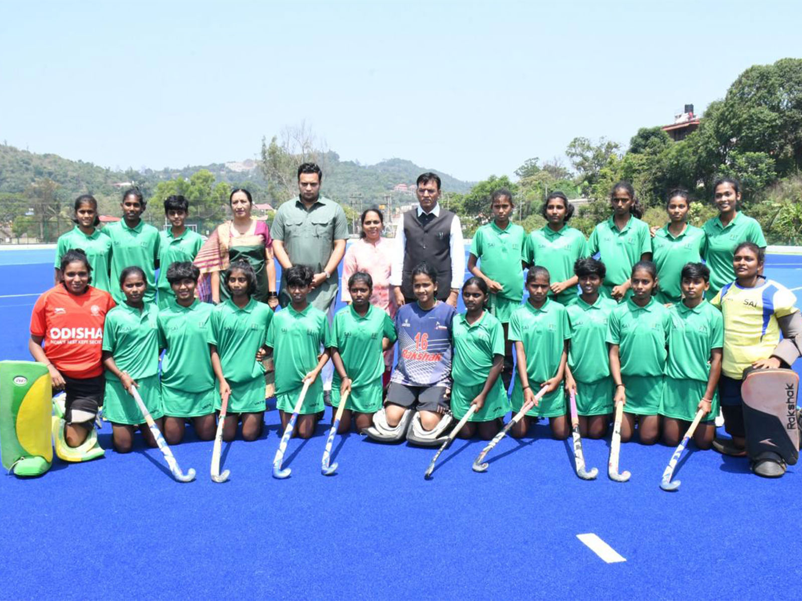 Mansukh Mandaviya with women hockey players from the Kodava community (Photo: SAI)
