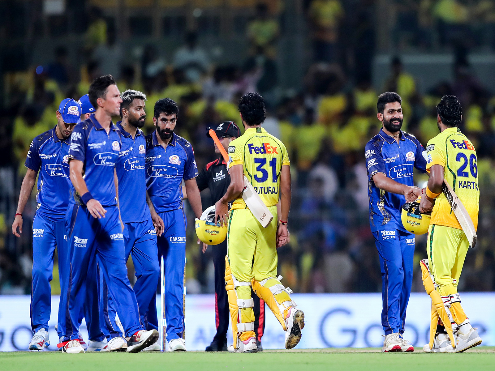 MI players shaking hands with CSK batters. (Photo/ANI)