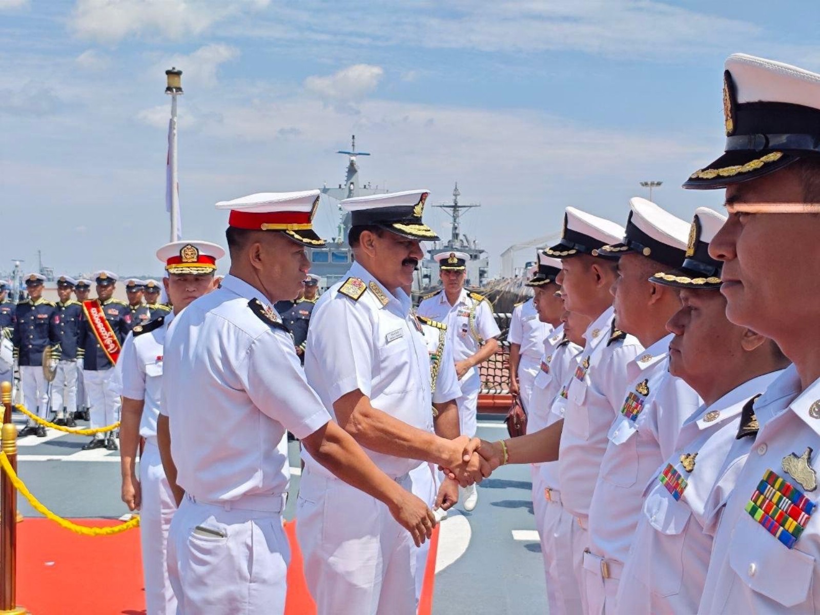 Indian Navy Chief Dinesh K. Tripathi greets Myanmar Navy personnel during a ceremonial welcome (Image Source: Indian Navy)
