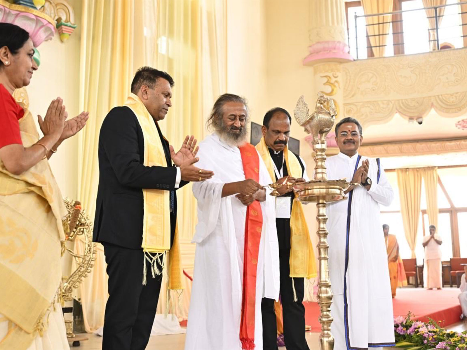 Spiritual leader Sri Sri Ravi Shankar lights the ceremonial lamp during the BIMSTEC Youth Leadership Exchange Programme organised by the Art of Living Foundation in India. (Photo: X/@MEAIndia)