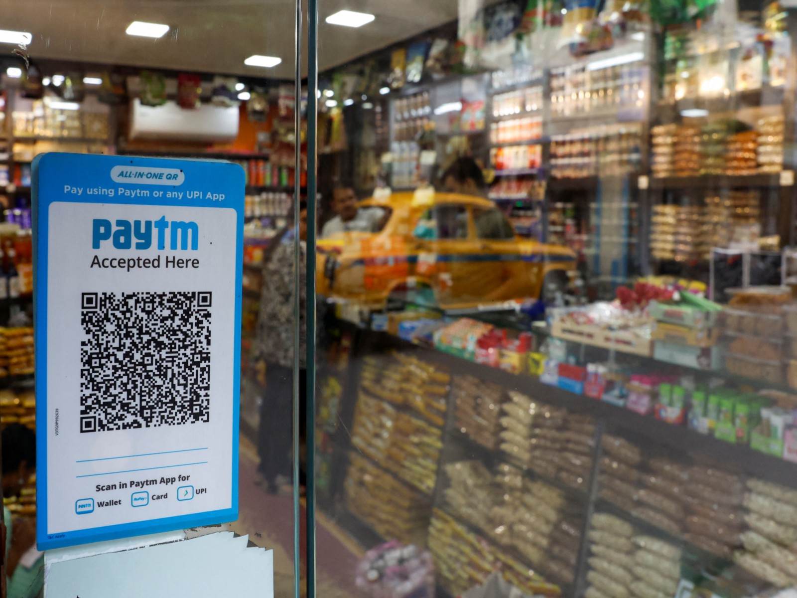 A QR code sticker of the digital payment app Paytm is seen outside a grocery store in Kolkata (Photo/Reuters)
