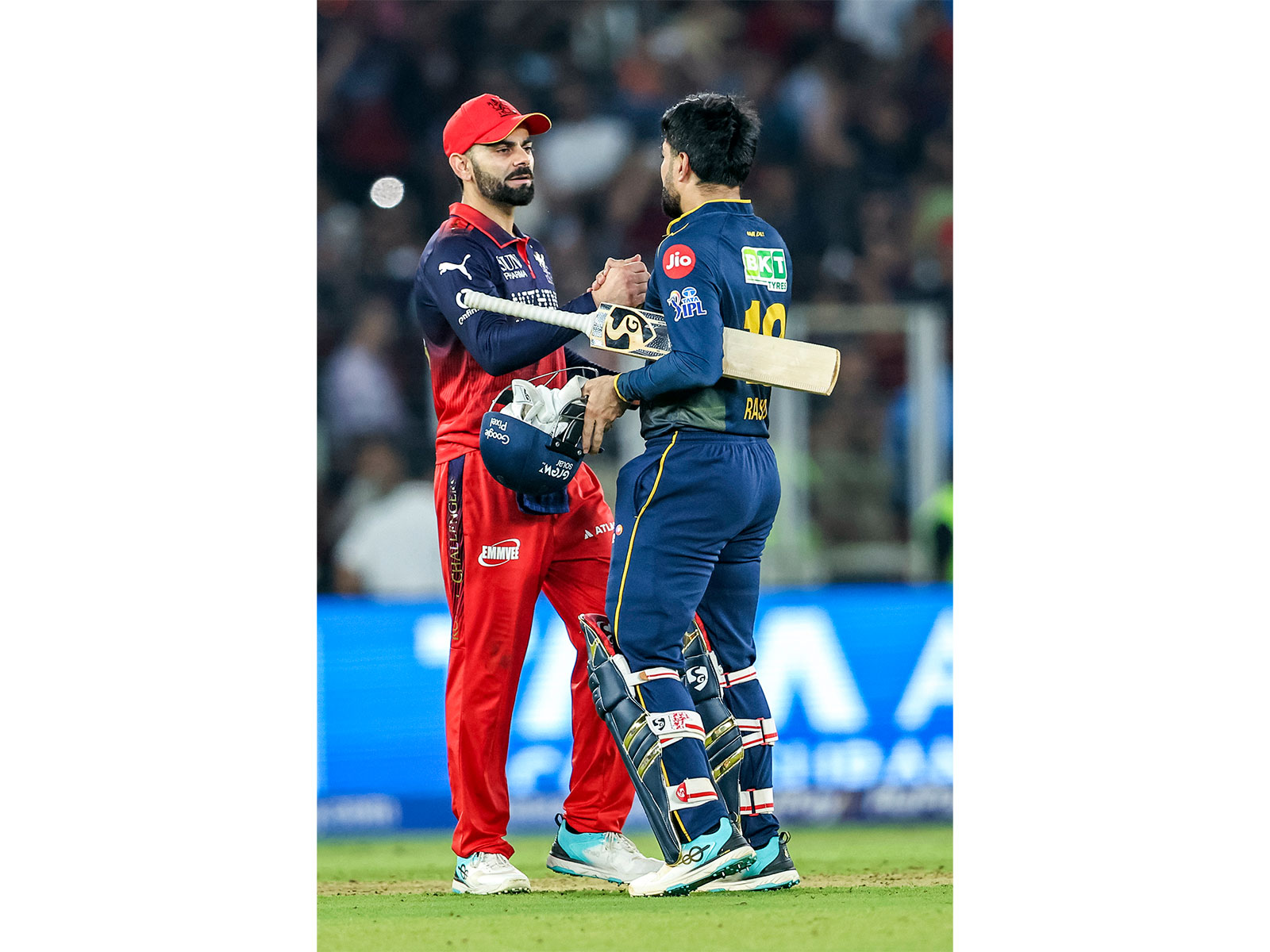 Virat Kohli with Rashid Khan. (Photo/ANI)