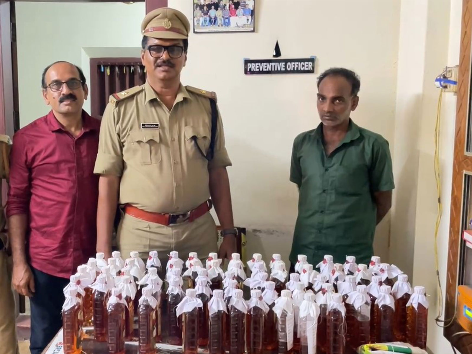 Keralam excise team arrests two with 60 bottles of liquor (Photo/ANI)