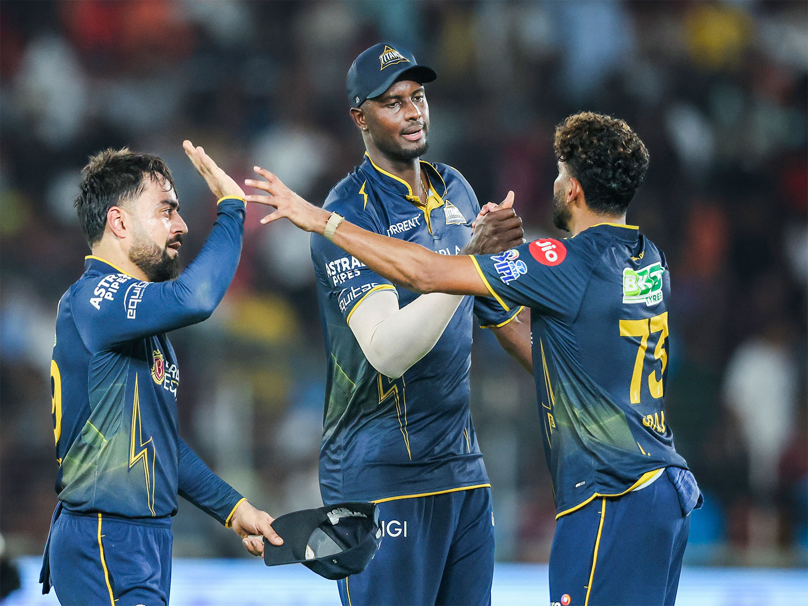 GT's  Jason Holder (middle) celebrating with teammates (Photo: ANI)
