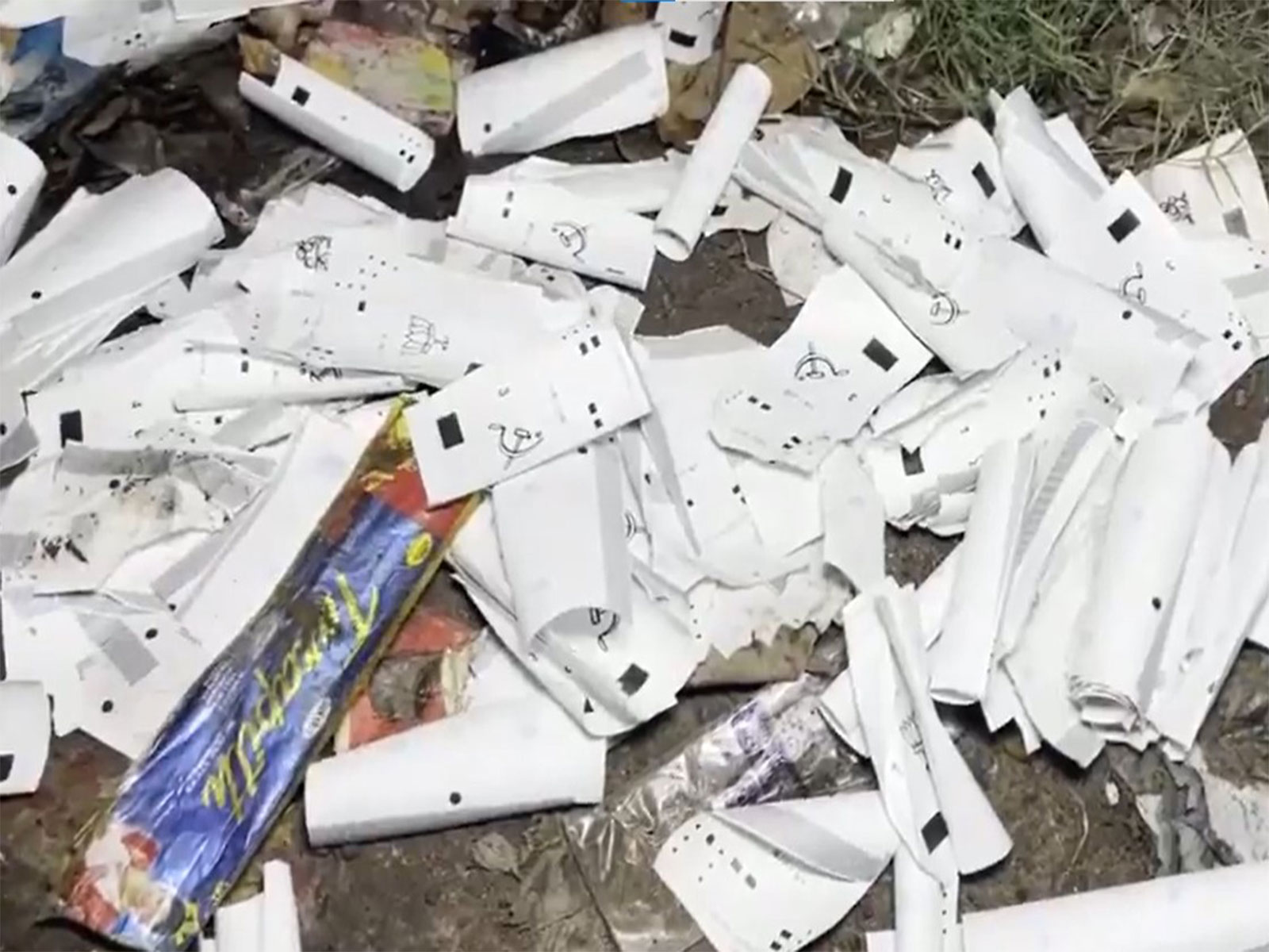 VVPAT slips  allegedly from booth number 29 of   Noapara Assembly were found discarded in Subhashnagar (Photo/ANI)