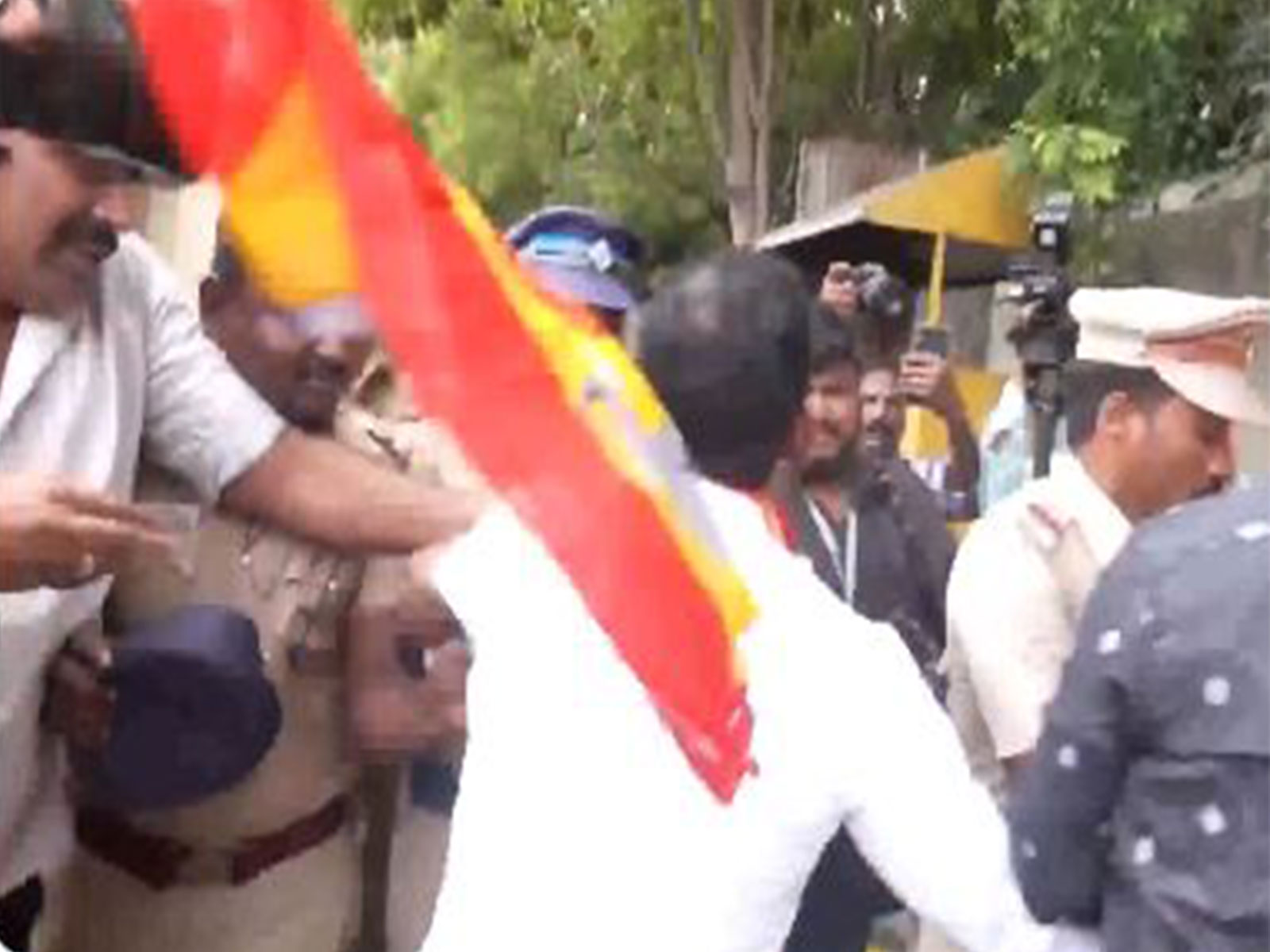 A TVK worker protests outside  Lok Bhavan in Chennai (Photo/ANI)