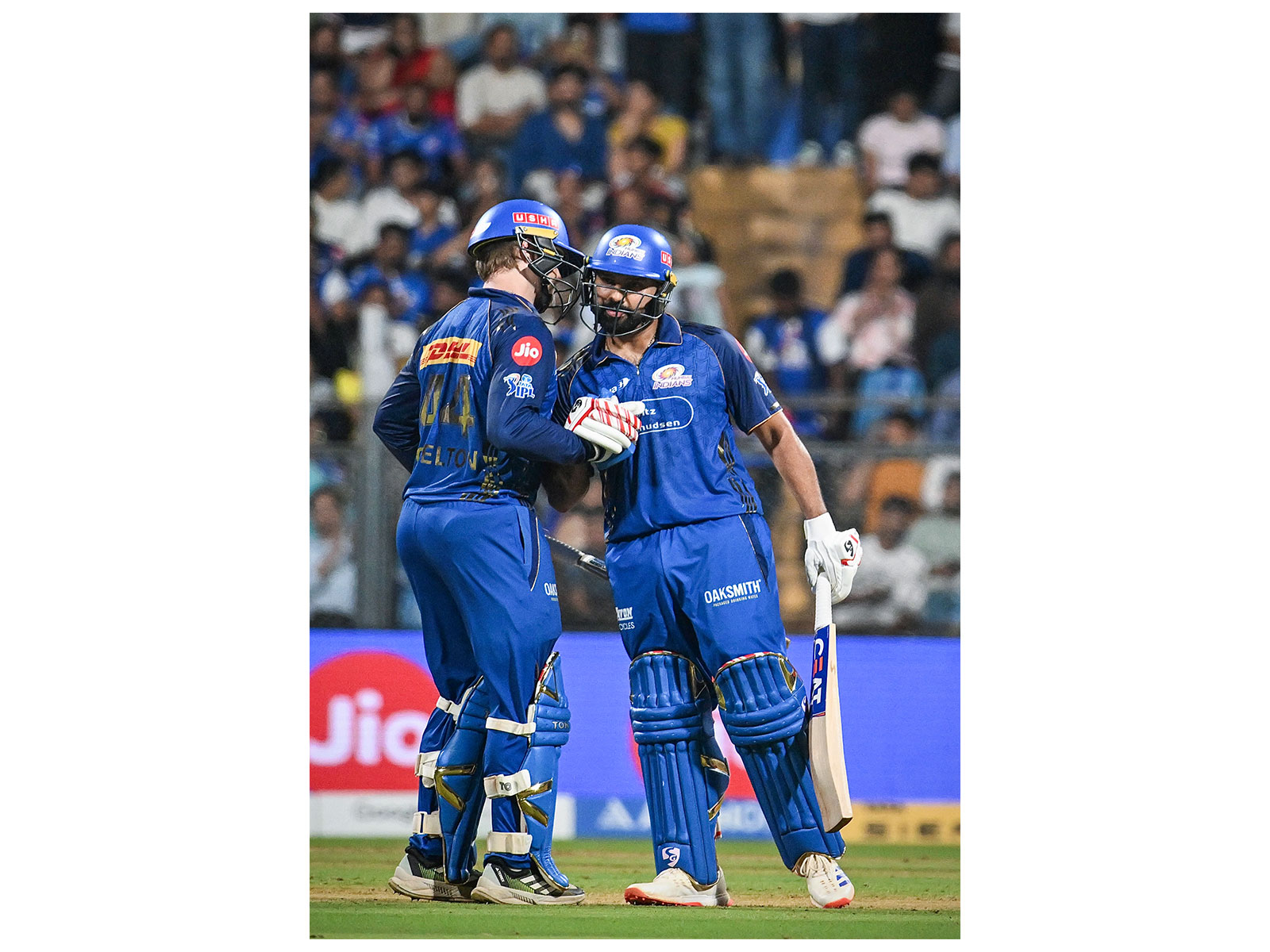 MI's Ryan Rickelton with Rohit Sharma celebrating his half-century during IPL 2026 clash vs LSG. (Photo: ANI)