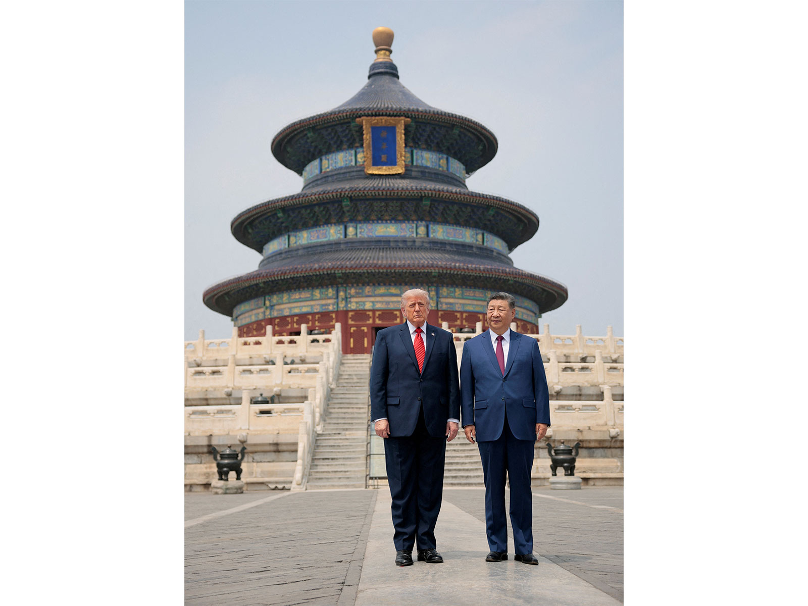 U.S. President Donald Trump and Chinese President Xi Jinping stand together as they tour the Temple of Heaven in Beijing (Photo/Reuters)