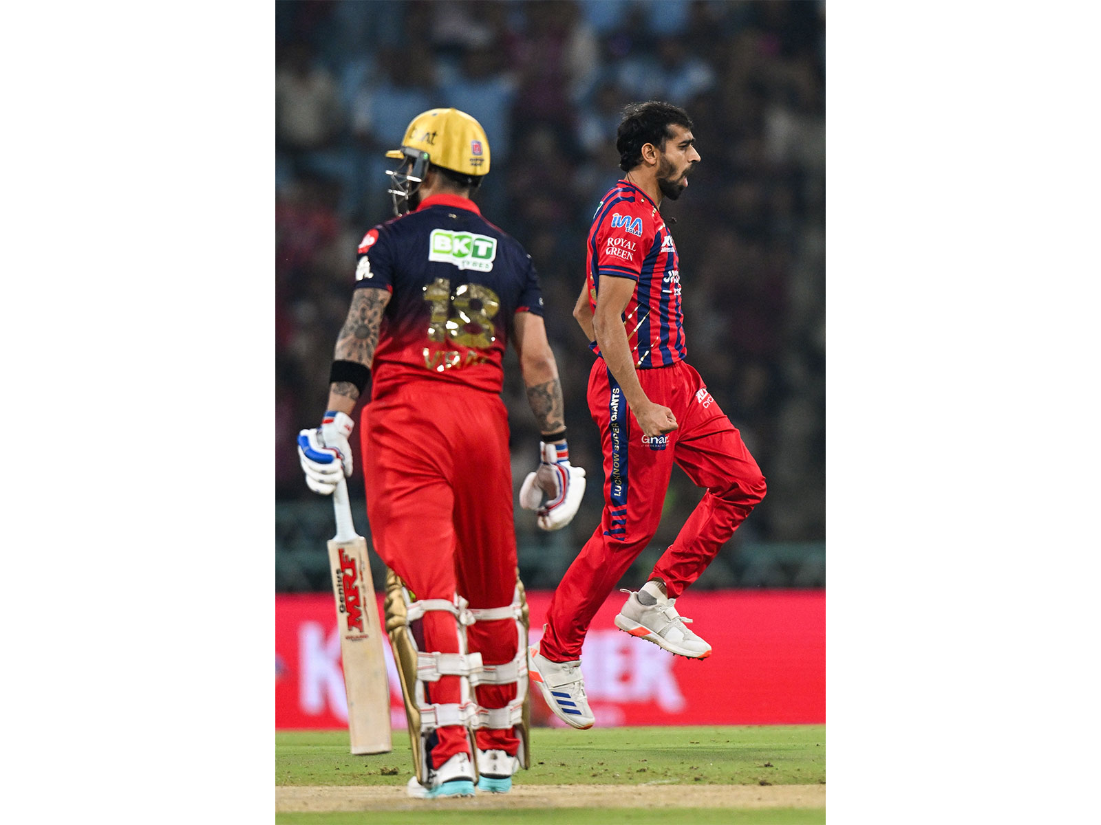 LSG's Prince Yadav (right) celebrating the wicket of RCBs Virat Kohli (left) (Photo: ANI)