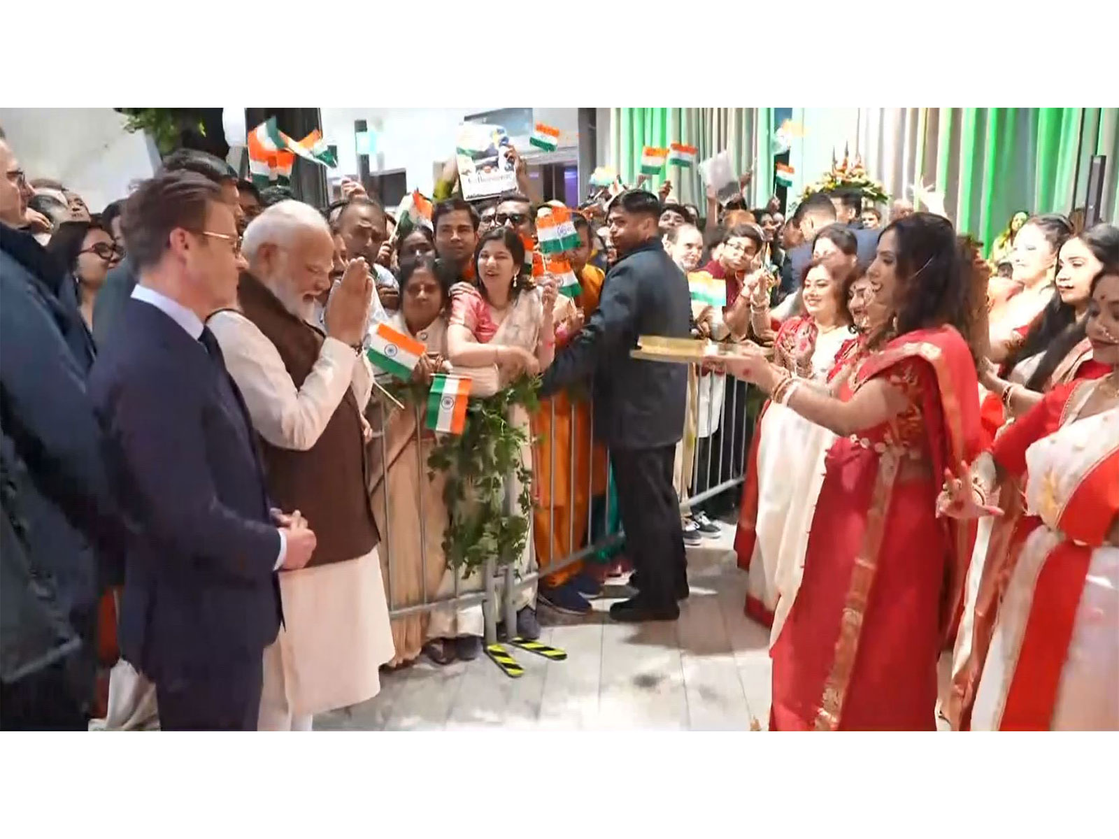 Prime Minister Narendra Modi receives a traditional Bengali cultural welcome from members of the Indian diaspora in Gothenburg, Sweden. (Photo/ANI)