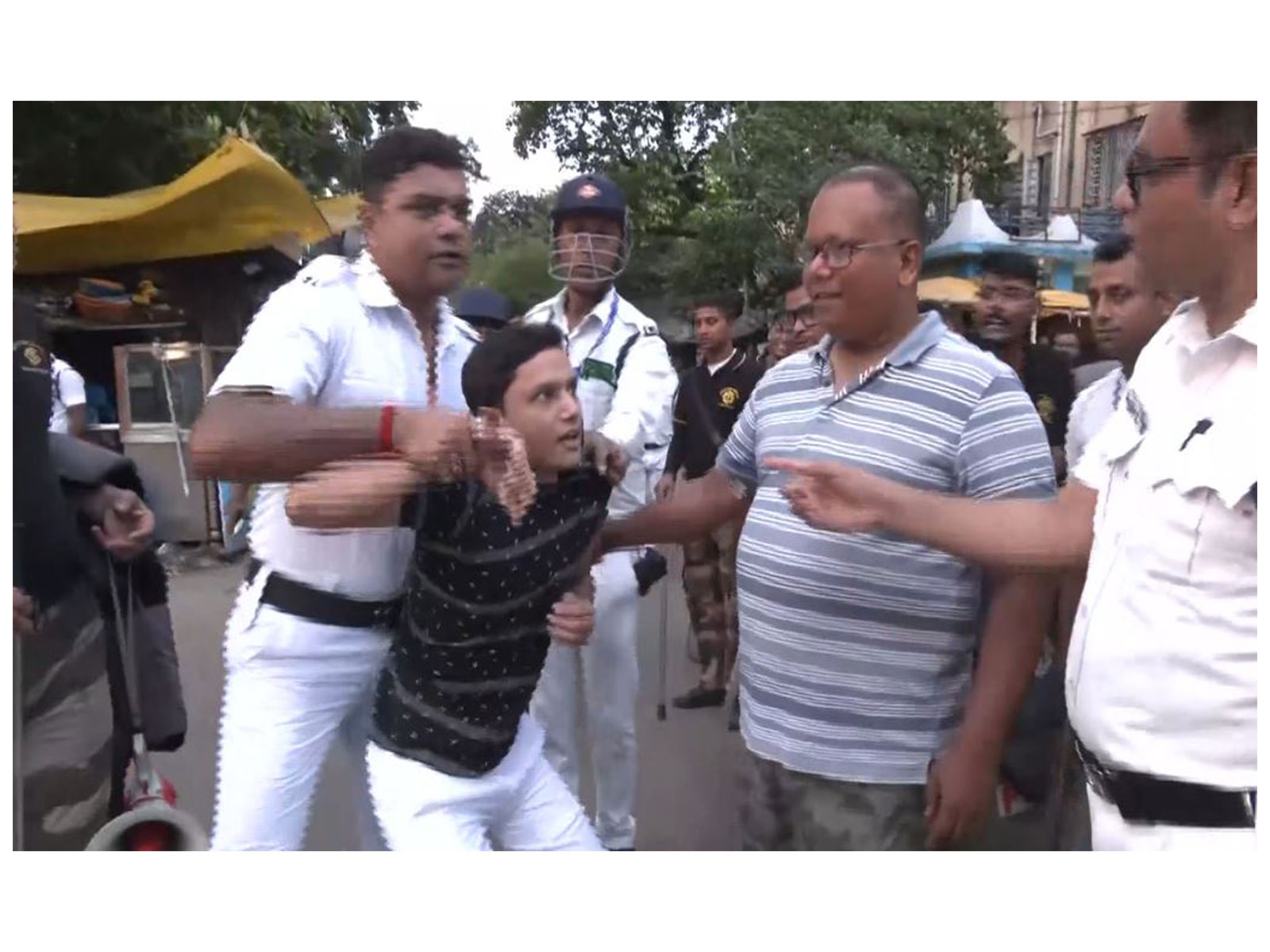 West Bengal Police detain protester (Photo/ANI)