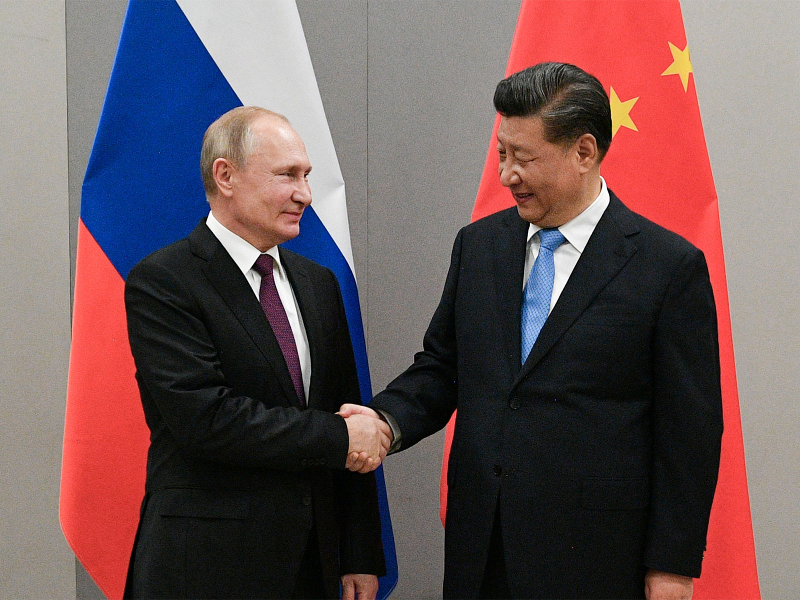 Russian President Vladimir Putin shakes hands with Chinese President Xi Jinping during their bilateral meeting (File Photo/Reuters)