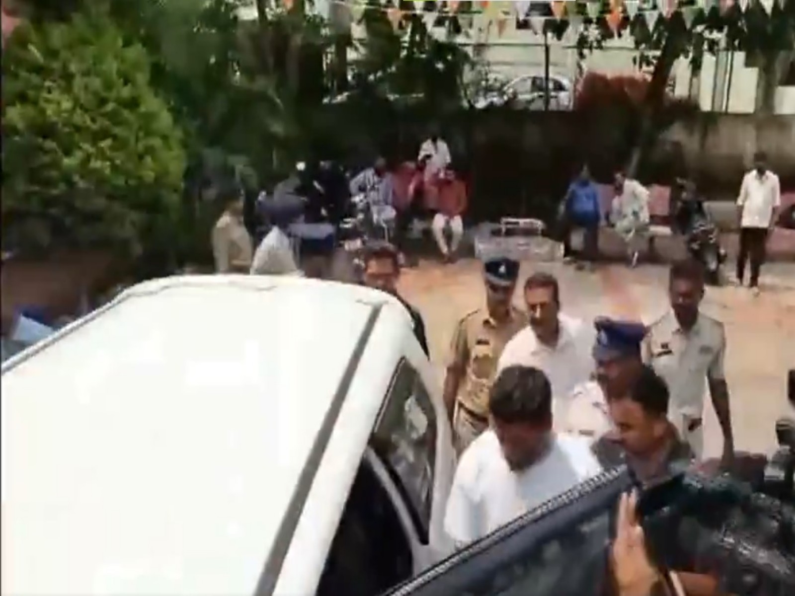 Shivananda Neelannavar (White t-shirt), the prime accused in the alleged Rs 4,500-crore deposit fraud case, has been shifted to Bengaluru by the CID (Photo/ANI)