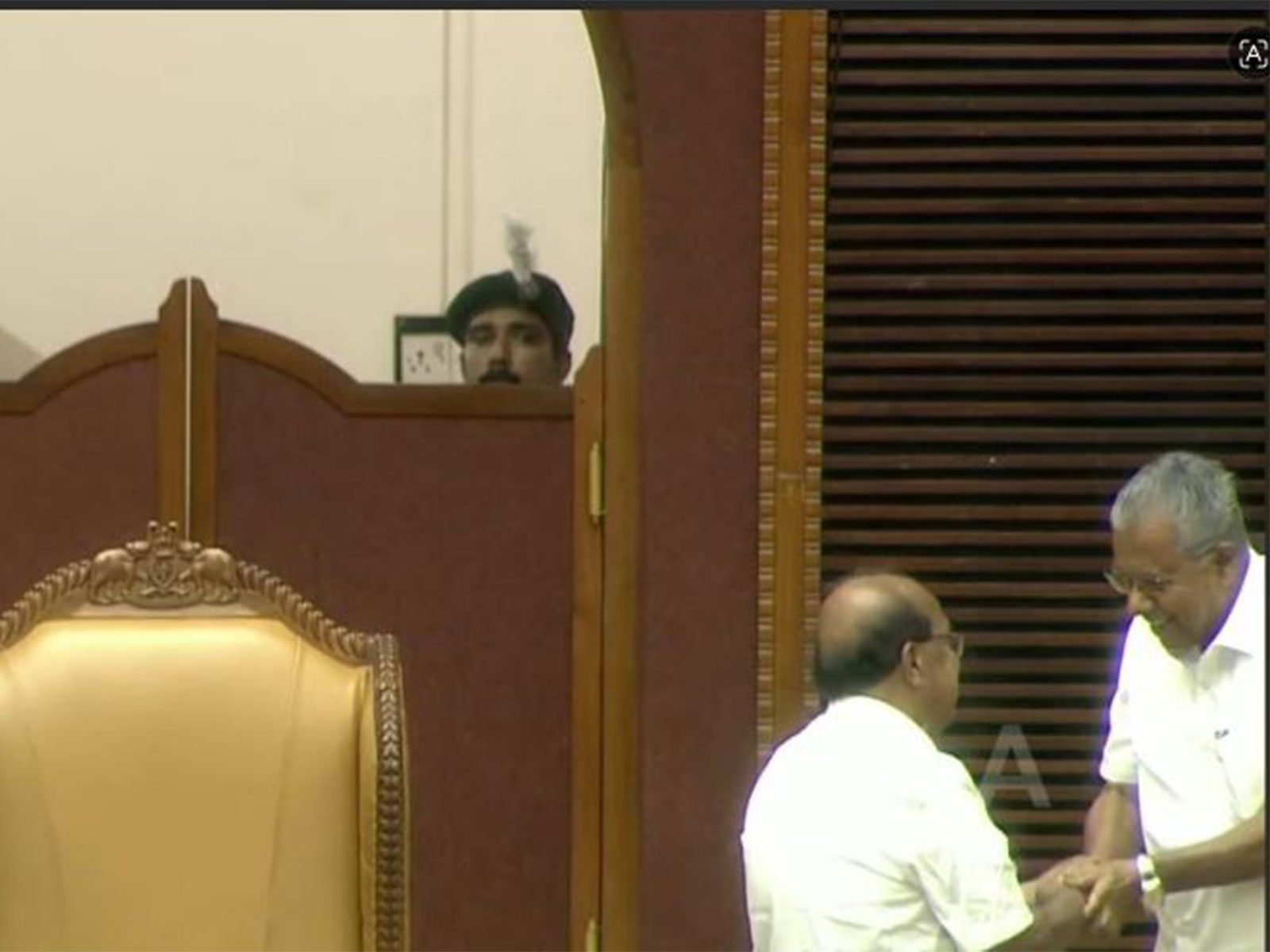 Screegrab of the handshake between G Sudhakaran (left) and Pinarayi Vijayan (Photo/ Kerala Niyamasabha)