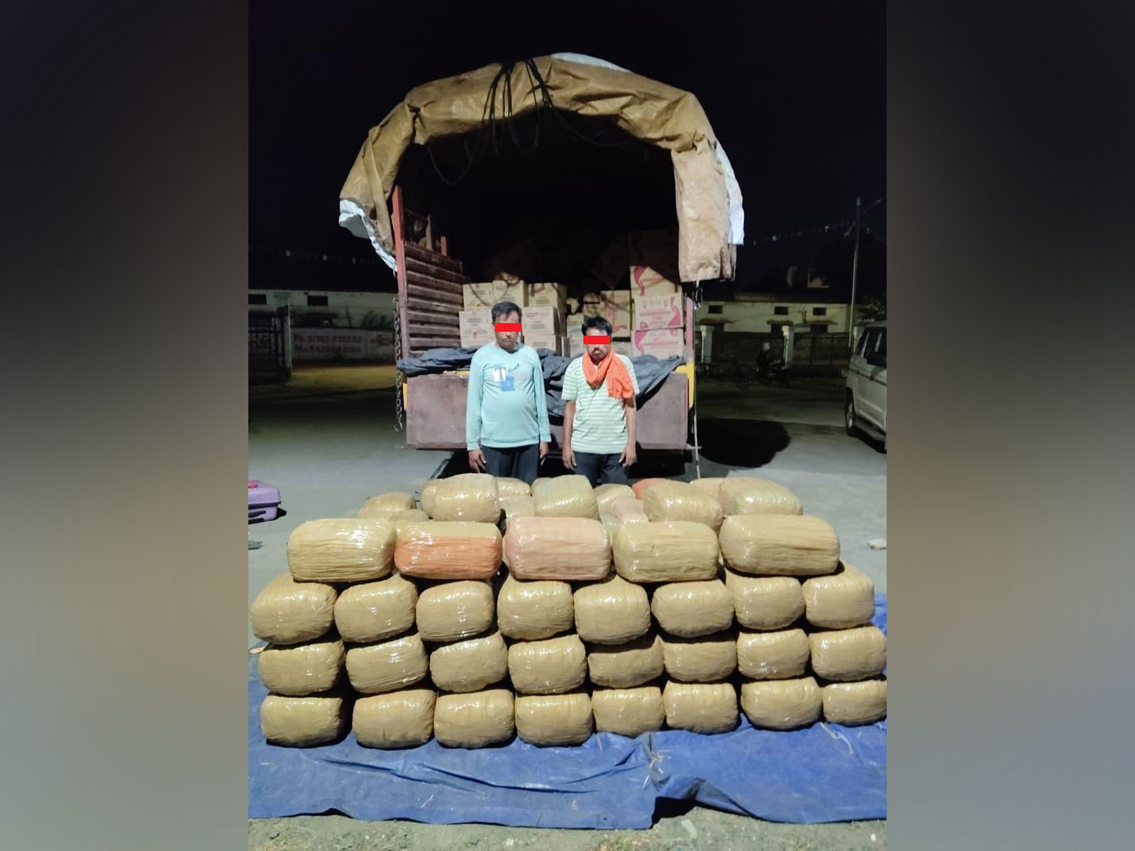 The accused, along with the consignment of the ganja  (Photo/NCB)