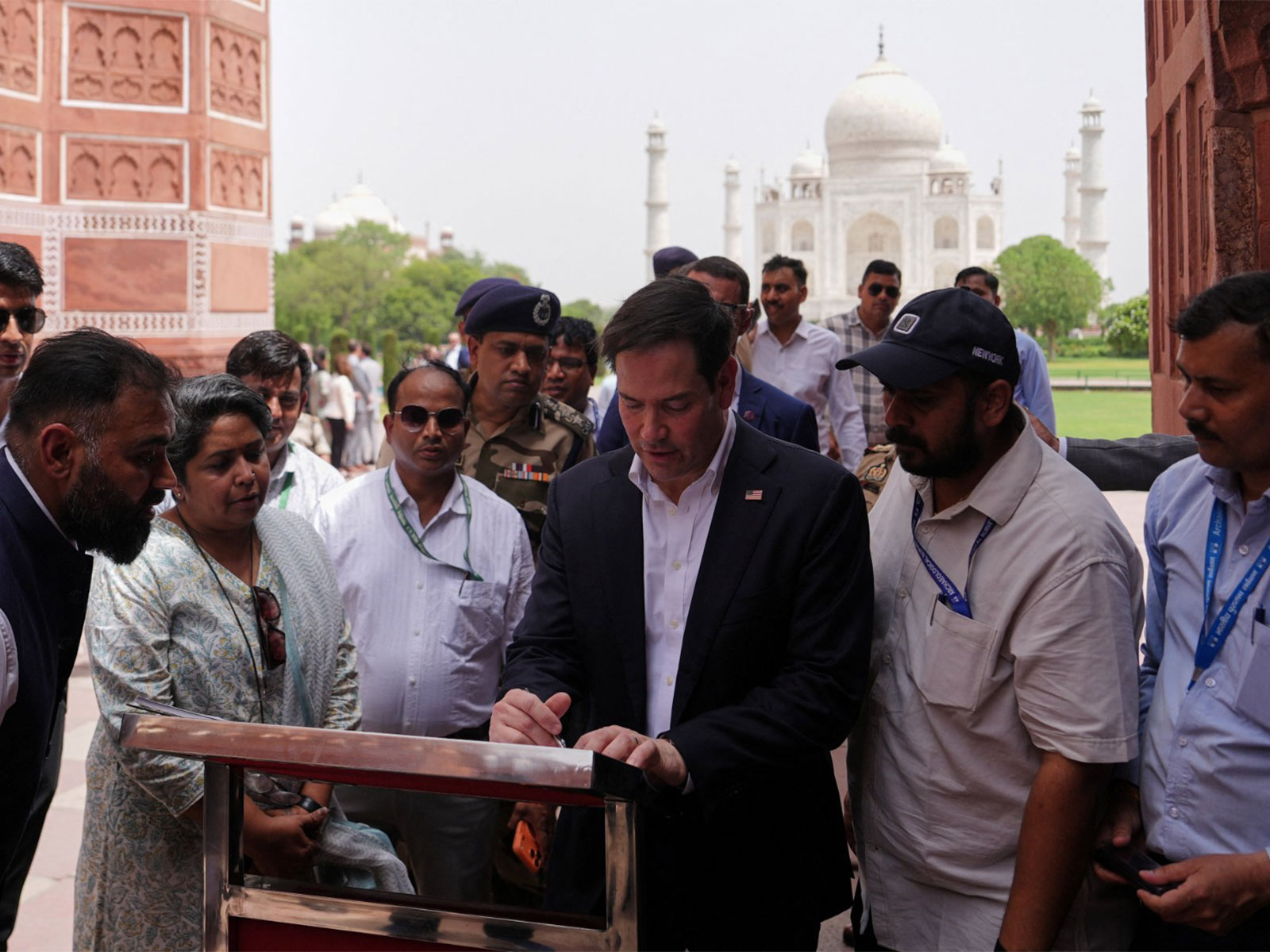 United States Secretary of State Marco Rubio signs the visitors' book during his visit to the Taj Mahal (Photo/Reuters)