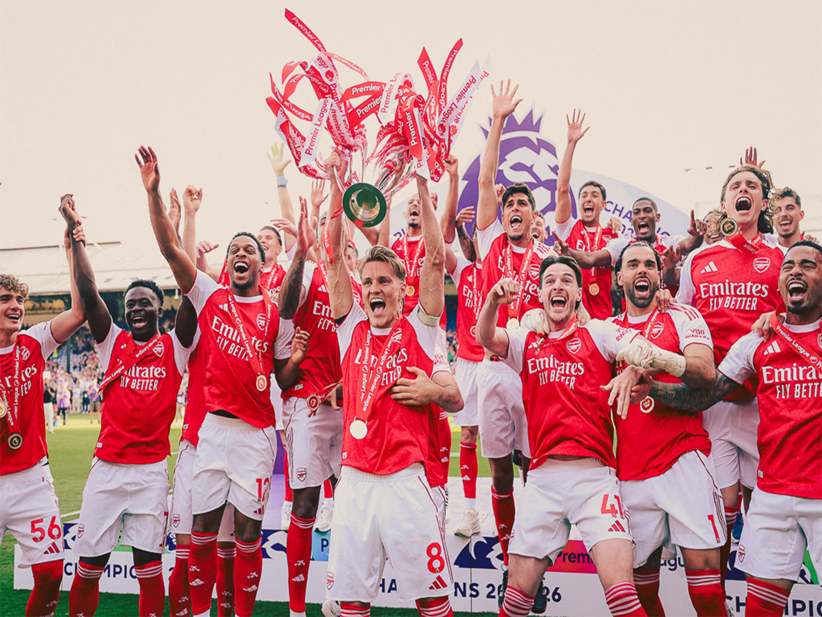 Arsenal football team celebrating with the Premier League trophy. (Photo: @Arsenal X)
