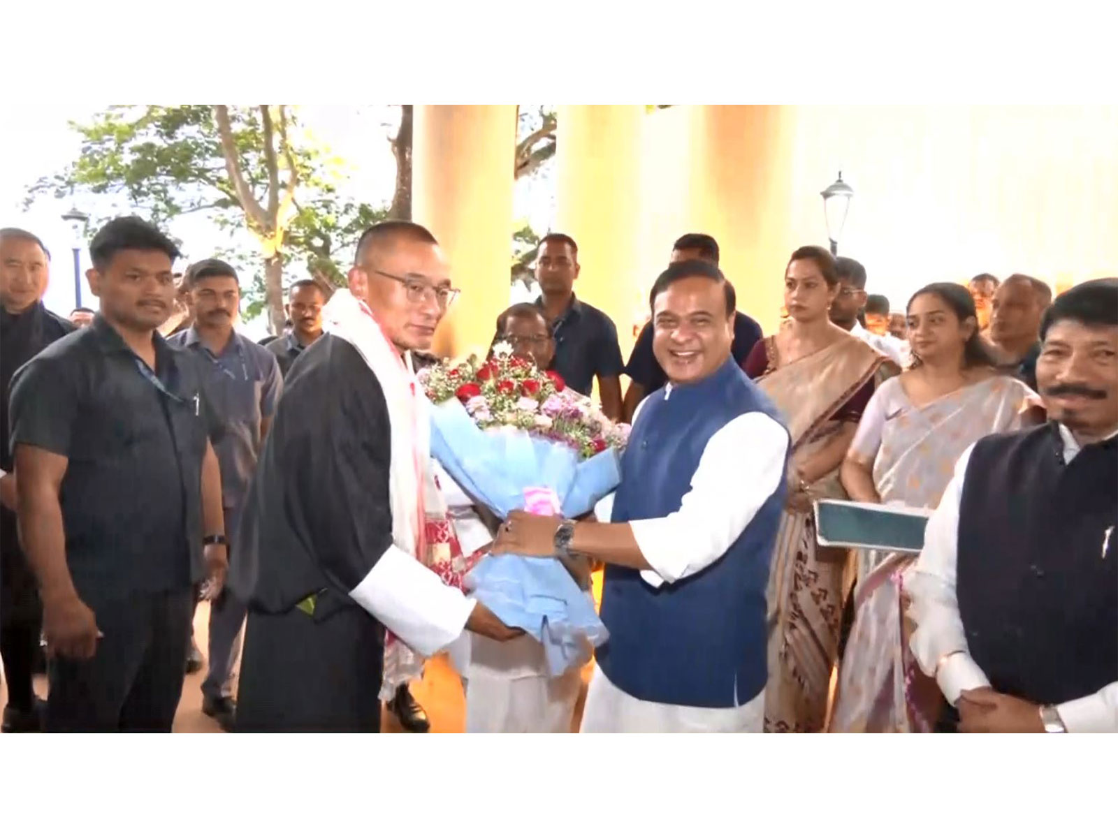 Assam Chief Minister Himanta Biswa Sarma welcomes Bhutan Prime Minister Tshering Tobgay with a floral bouquet upon his arrival in Guwahati. (Photo/ANI)