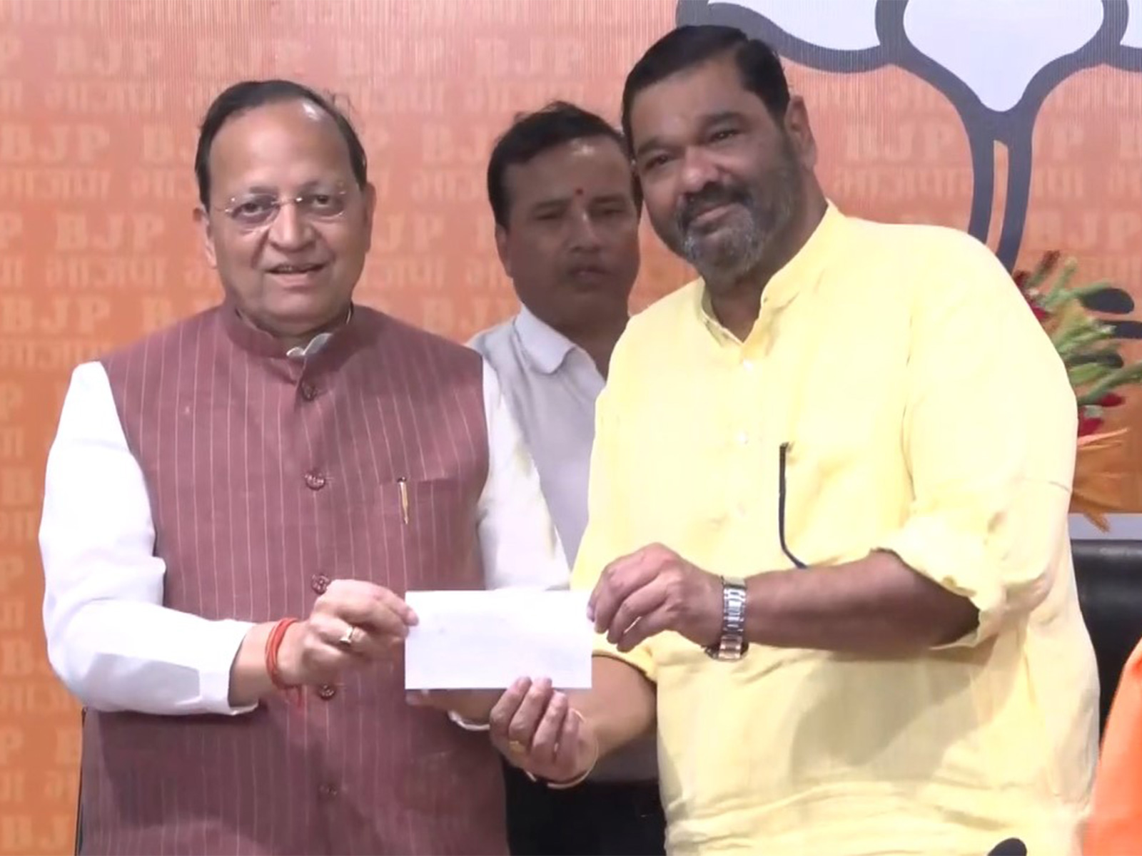 MP Debashish Samantaray (R) joins BJP (Photo/ANI)
