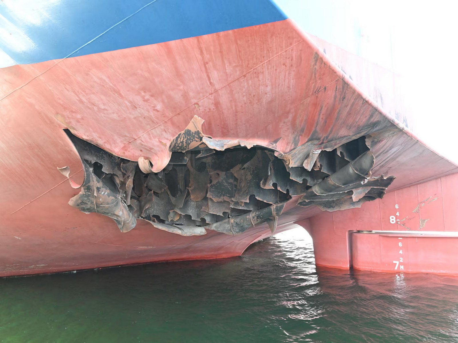 Damaged stern of the HMM-operated bulk carrier HMM Namu after it was struck by two unidentified objects while stranded in the Strait of Hormuz on May 4. (Photo/Reuters)