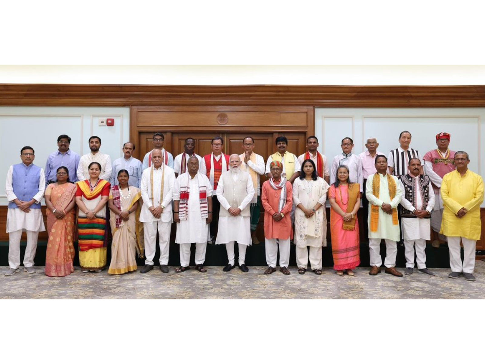 Prime Minister Narendra Modi with representatives of the Janjati Suraksha Manch (Photo/@narendramodi)