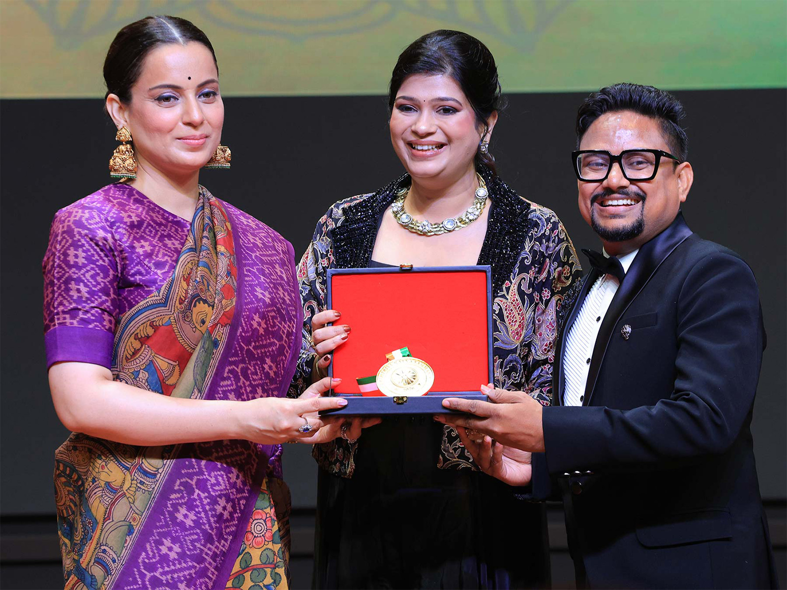 On stage at the Rashtriya Ratna Samman 2026, Mr. Vivek Kumar, Owner of My Print, receives the award for 'Most Trusted Name in Customized Printing Startup Business Solutions from Siliguri, West Bengal' from Ms. Kangana Ranaut.