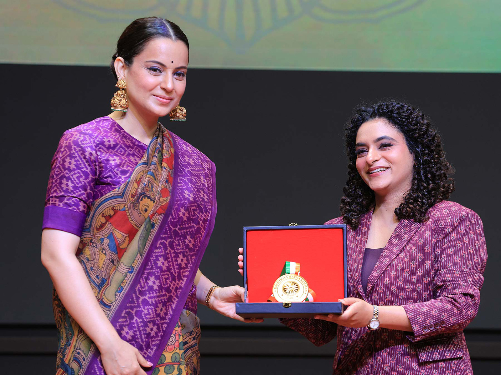 On stage at the Rashtriya Ratna Samman 2026, Dr. Anjalika Atrey, Consultant Psychiatrist, Mumbai, receives the award for 'Most Trusted Celebrity Psychiatrist in Mumbai' from Ms. Kangana Ranaut.