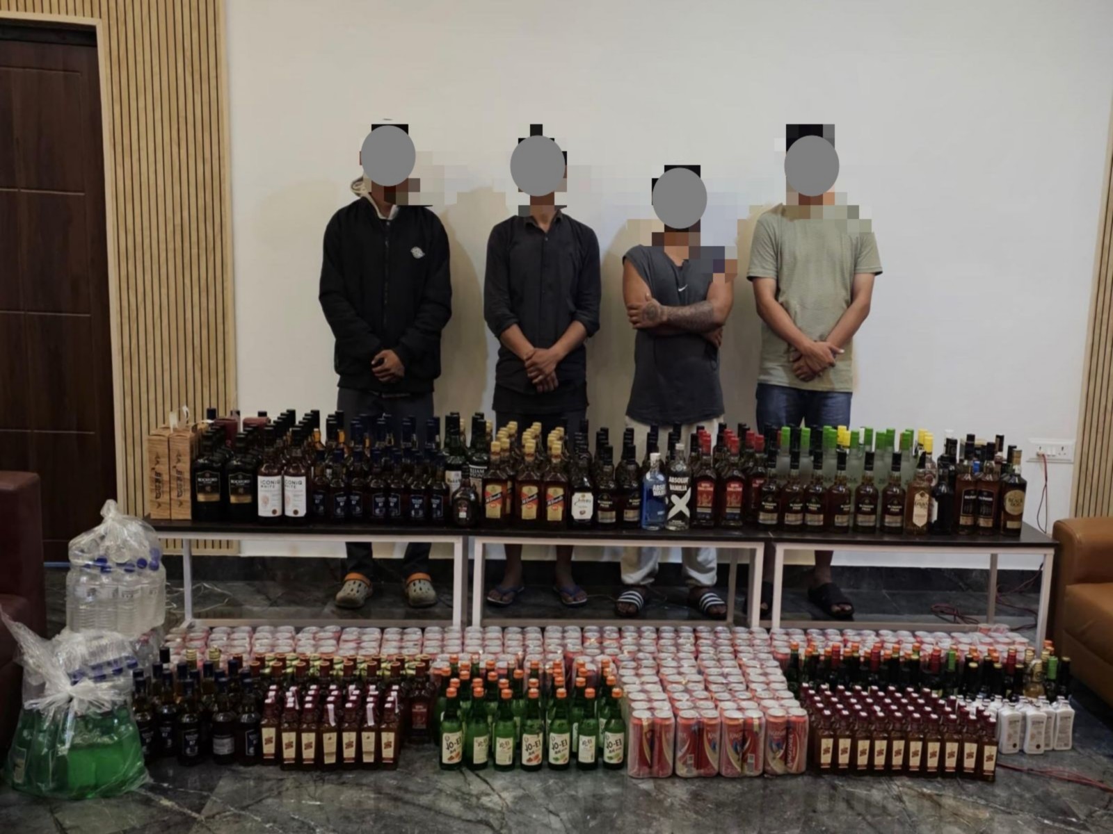 Manipur police with alleged illegal liquor sellers (Photo/Manipur Police Release)