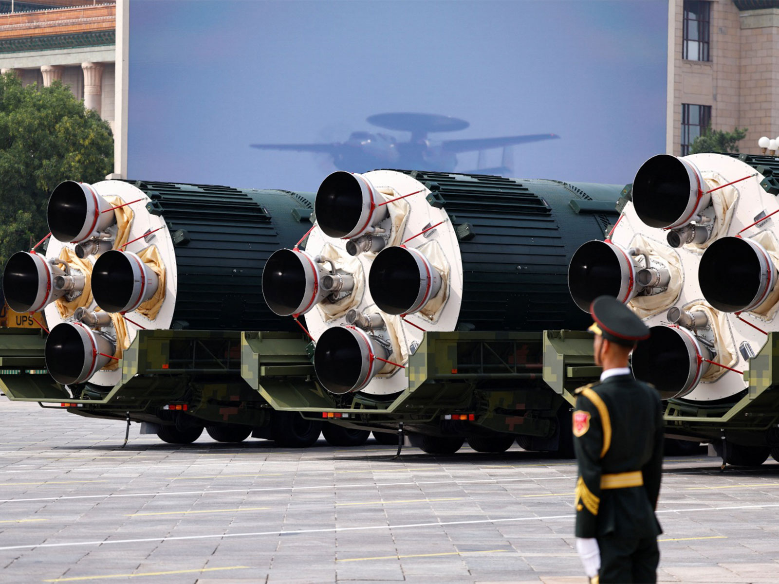 A member of the People's Liberation Army stands as the strategic strike group displays DF-5C nuclear missiles during a military parade in China (File Photo/Reuters)