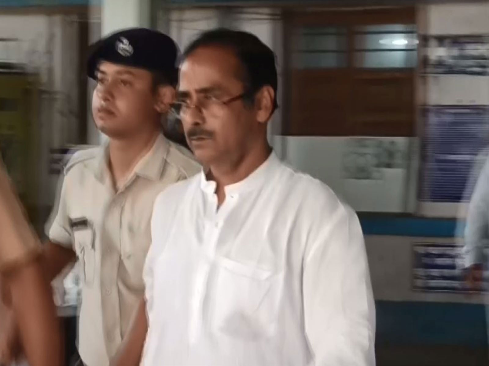 Visual of TMC leader Tilak Chakraborty being taken for medical examination by police in Haldia (Photo/ANI)