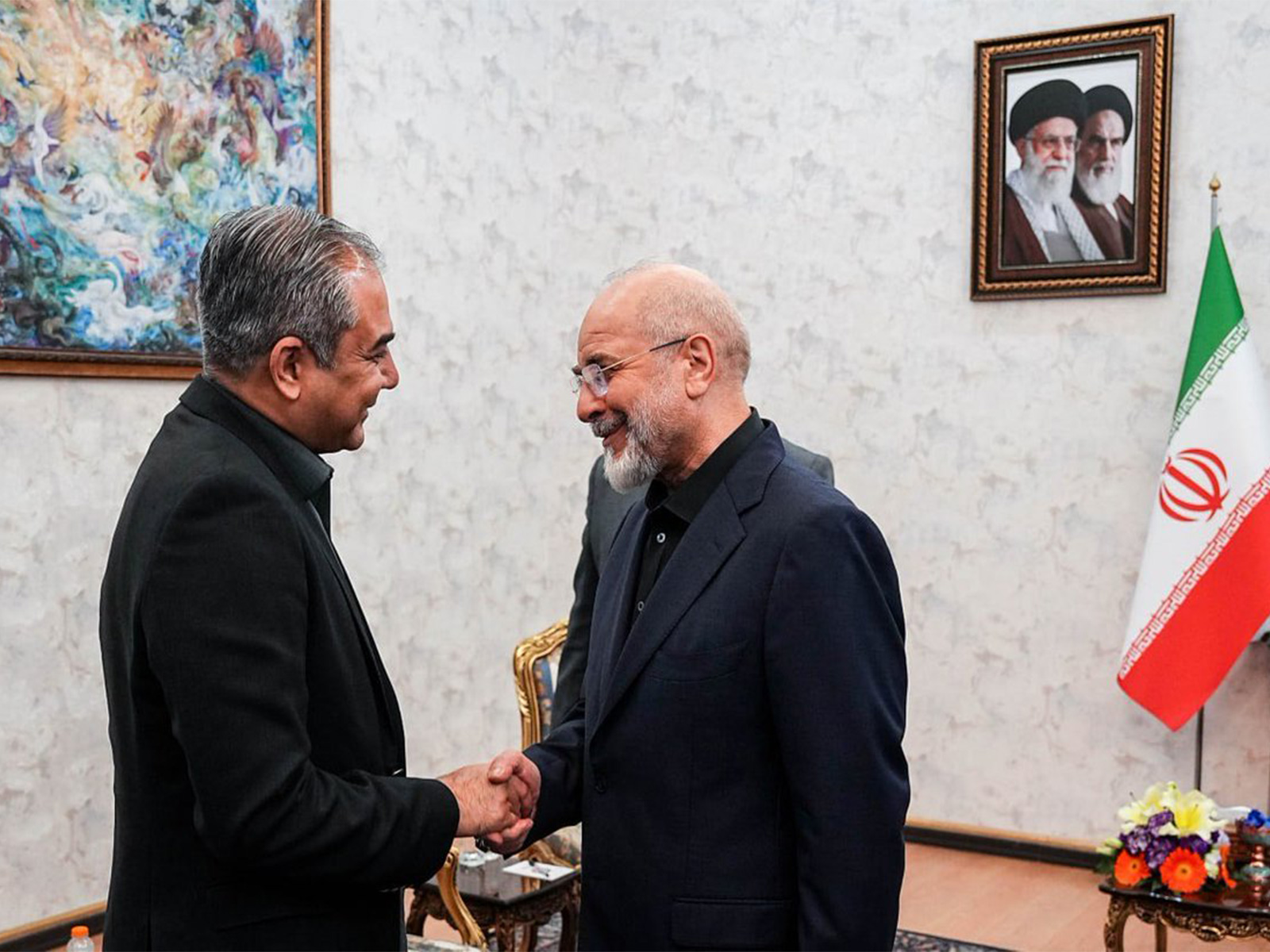 Iranian Parliament Speaker Mohammad Bagher Ghalibaf shakes hands with Pakistan's Interior Minister Mohsin Naqvi during their meeting in Tehran, Iran. (Image Source: Iranian state media)