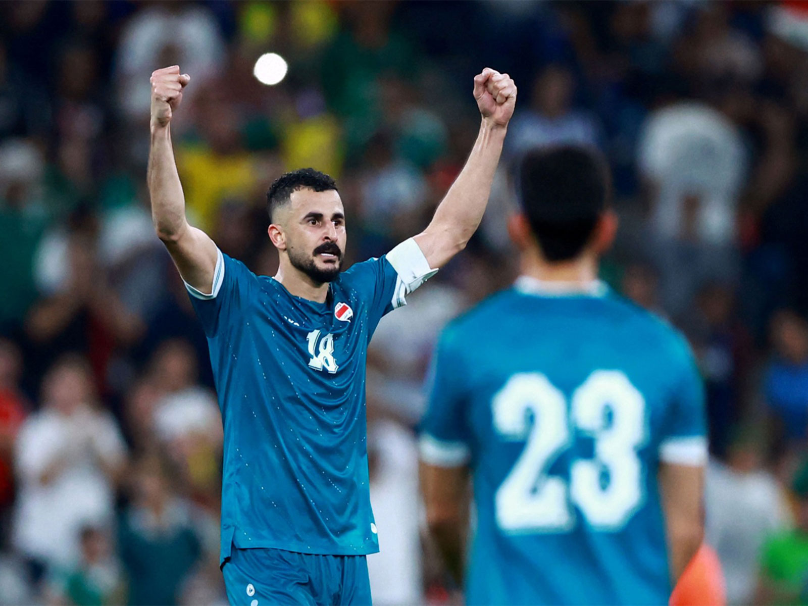 Iraq's Aymen Hussein celebrates scoring their second goal. (Photo: Reuters)
