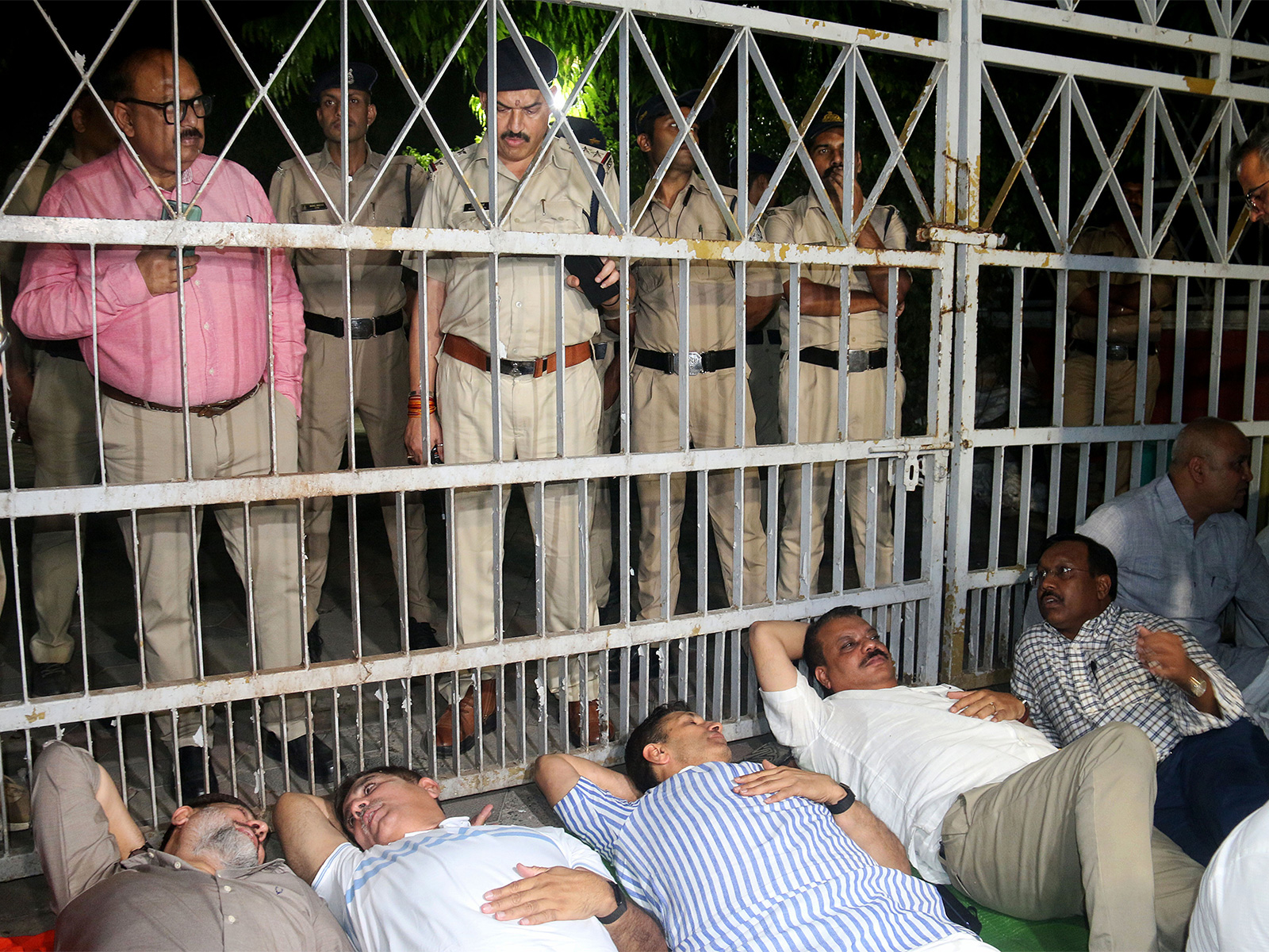 Congress leaders Harish Chaudhary, Jitu Patwari, Umang Singhar, and others hold a sit-in protest outside the Election Commission's office in Bhopal (Photo/ANI)