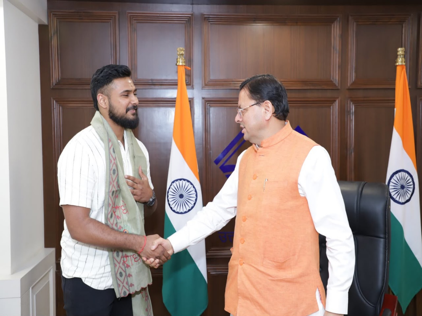 Ulhas KS (left) and CM Pushkar Singh Dhami (right) (Photo: LegaXy)