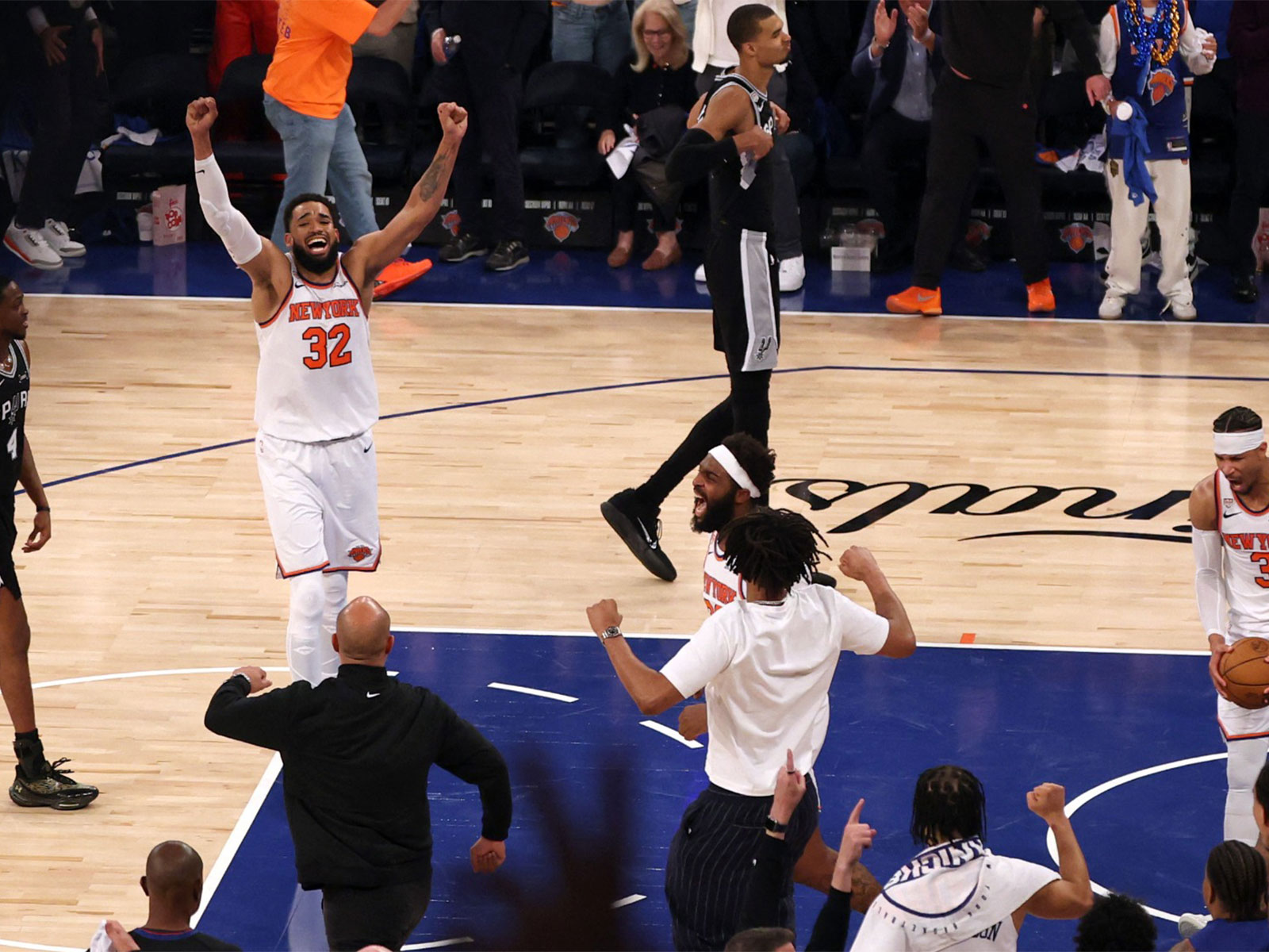 New York Knicks center Karl-Anthony Towns (32) celebrates after defeating the San Antonio Spurs in game four of the 2026 NBA Finals. (Photo: Reuters)